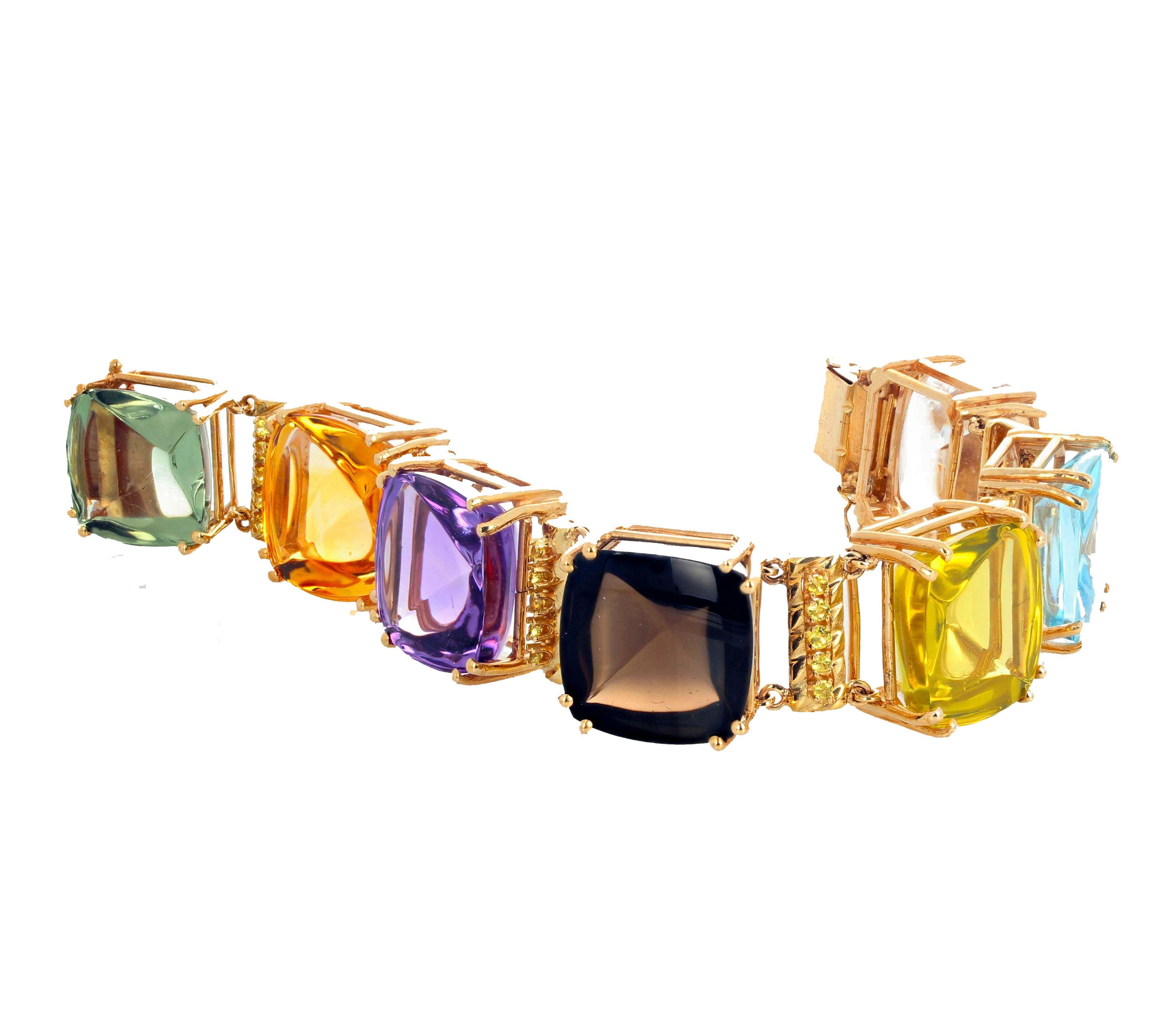 The gemstones on this beautiful 14K yellow gold bracelet that is 7 3/4 inches long are set up high to stand out in all lights.  They are 20 mm x 20 mm approximately.  The big gemstones are Madagascar Citrine, Amethyst, Silver Quartz, Lemon Quartz,