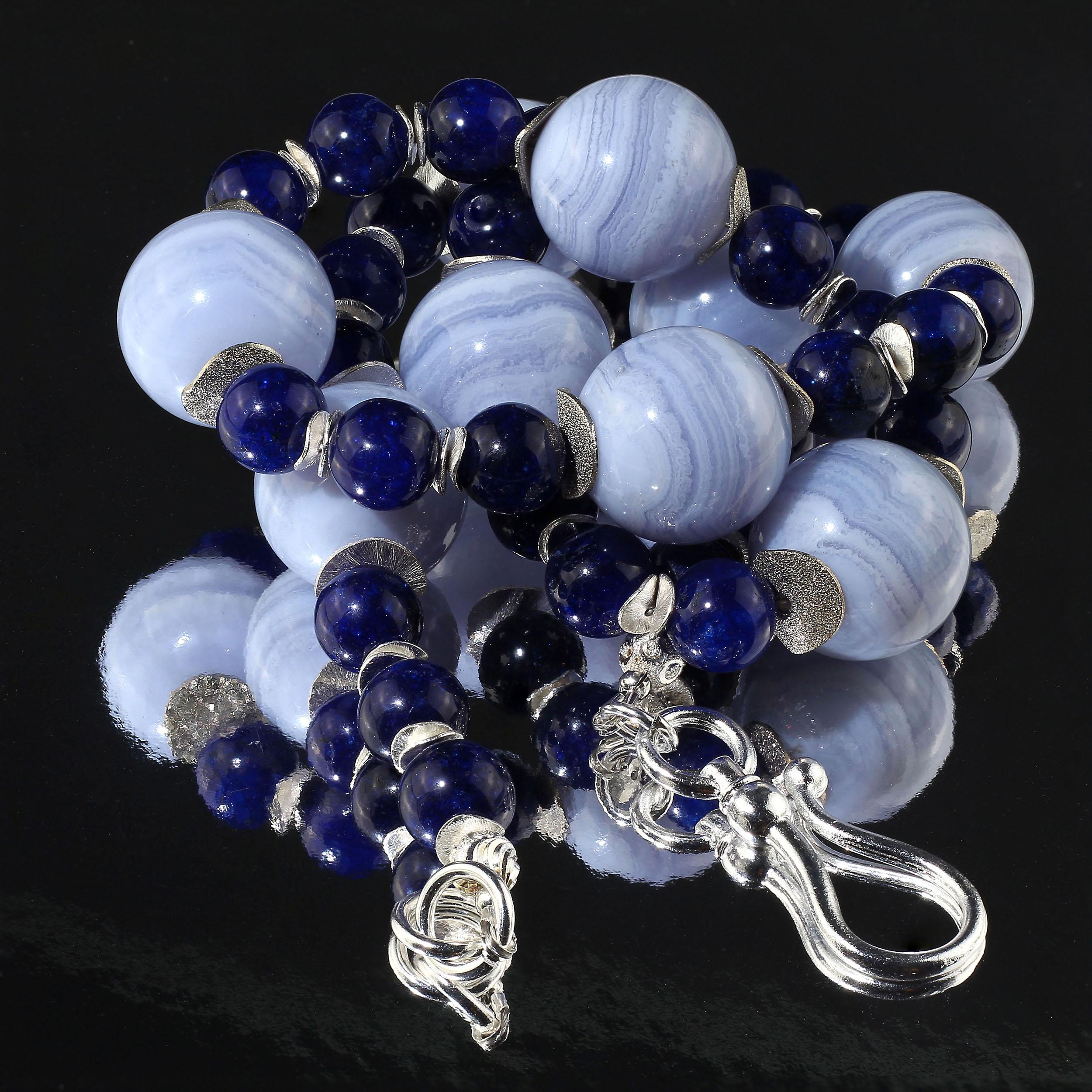 Always a Summer Favorite, Blue Lace Agate and Blue Agate necklace.  The 20 MM highly polished Blue Lace Agate is accompanied by highly polished dyed navy Agate.  The sparkling silver flutters enhance both blues.  At 23 inches this is a versatile