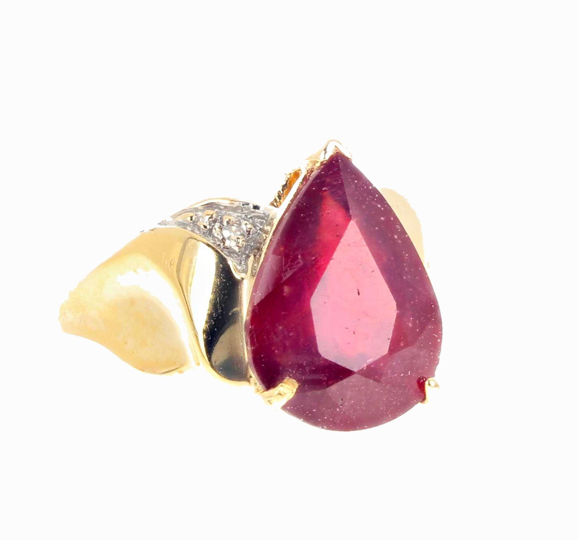 This intensely red natural 7.78 carat Sapphire (14.4mm x 10.8mm) is enhanced with teeny tiny real white Diamond side stones in this elegant sophisticated 14K yellow gold ring size 7 sizable (we size for free). 