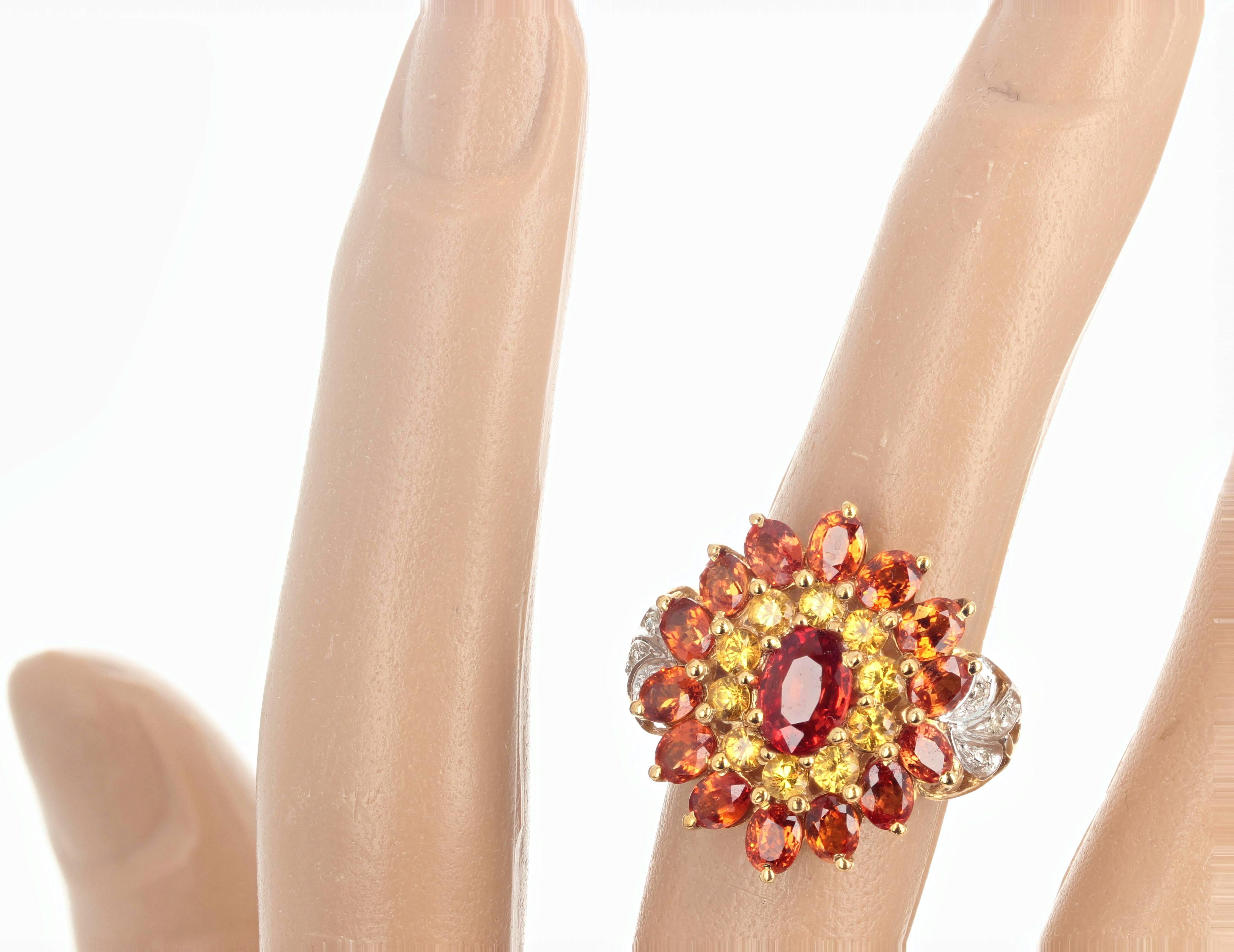 This intensely sparkling brilliant orangy red Citrine (largest one is 1.35 carats) is surrounded by little round yellow citrines (approximately 1/4 carat each) and oval glittering orangy yellow citrines (approximately 1/3 carat each) all enhanced by