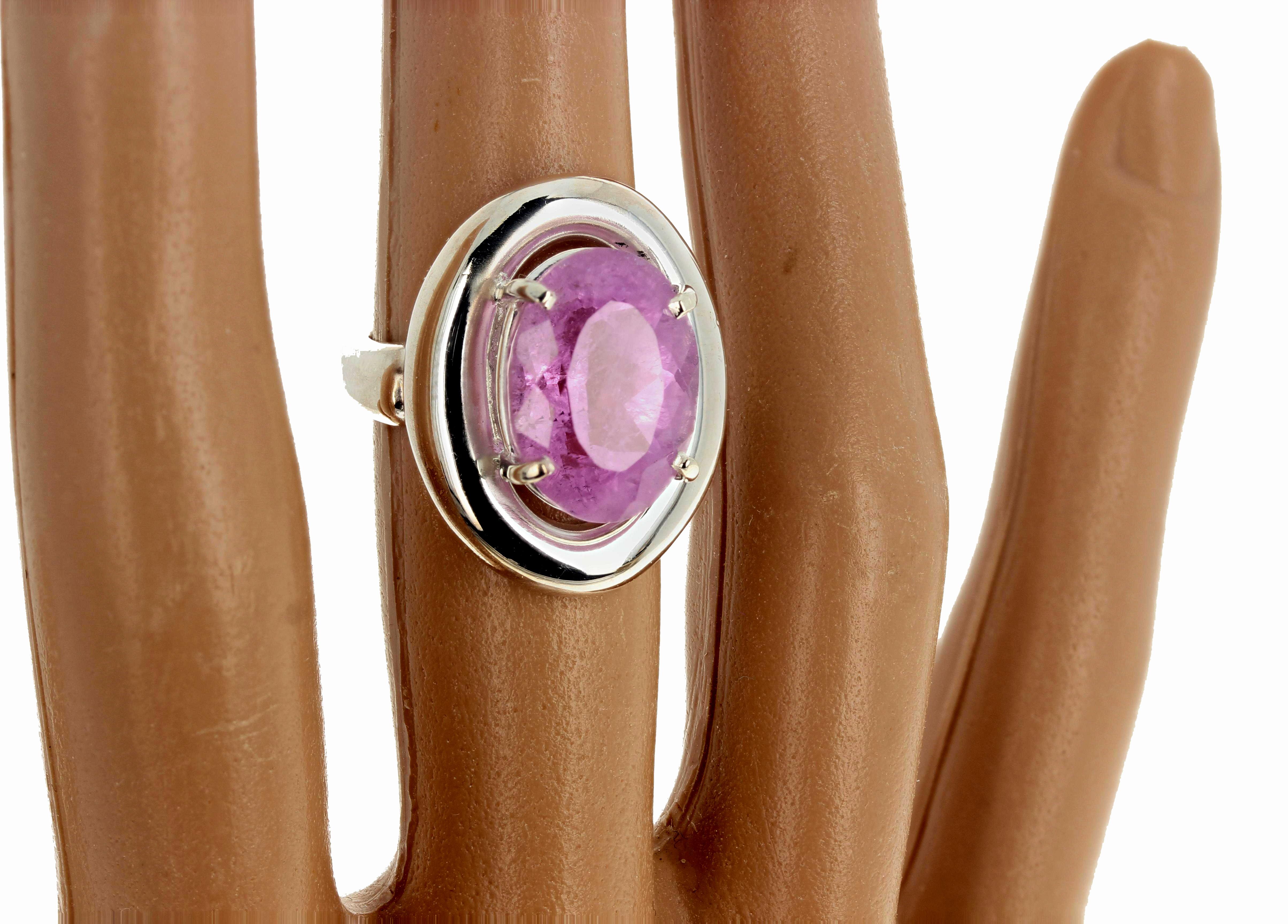 This intensely pink 9.76 carat natural Kunzite is 14.7 mm x 10.8 mm and is set high up in a lovely artistic sterling silver ring size 7 sizable (we size for free).  