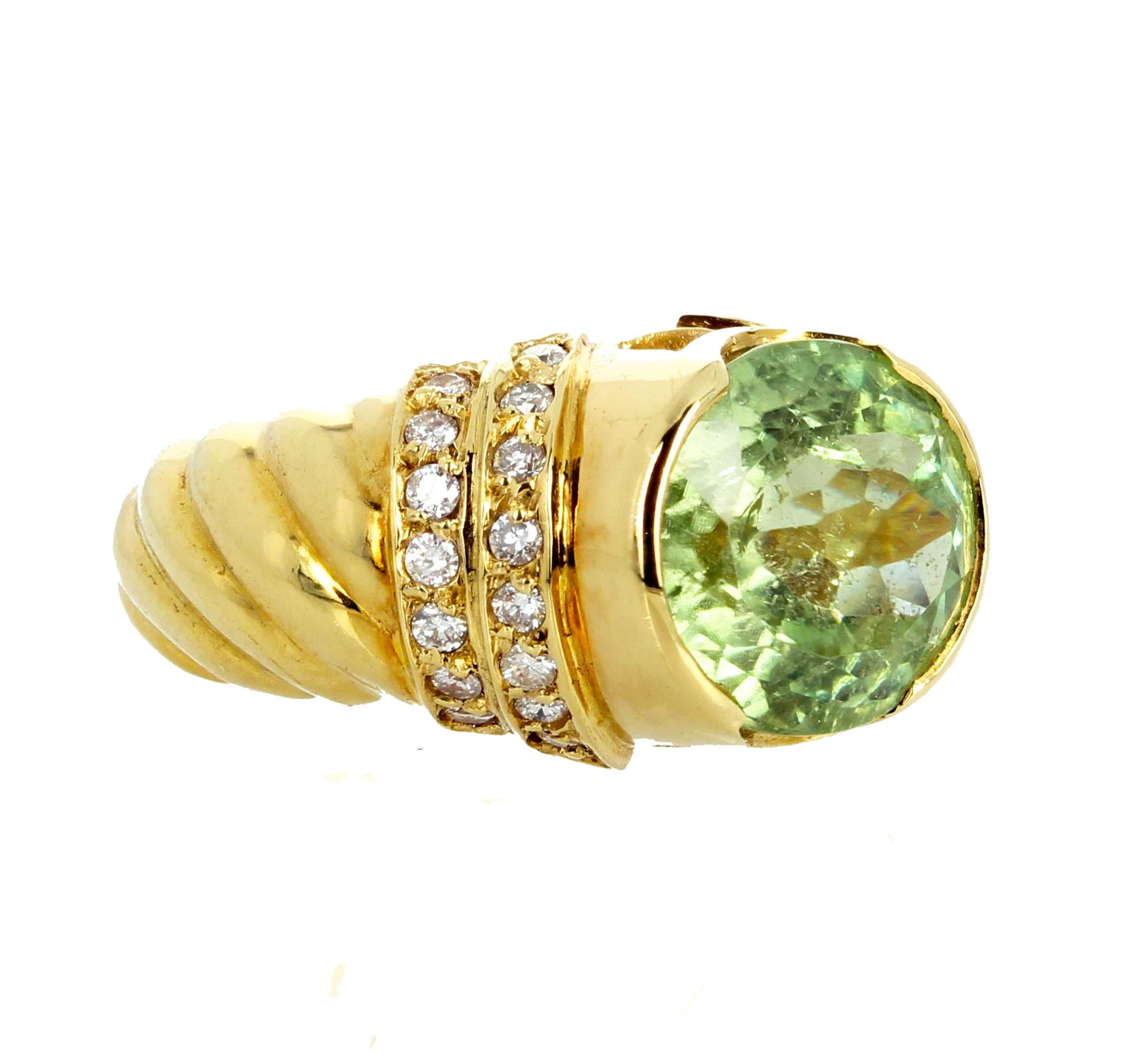 Gorgeous sparkling 8 carat natural translucent Green Tourmaline in this beautiful 18Kt yellow gold ring set with sparkling real little white Diamonds.  There are no eye visible inclusions.  This is a size 7 (sizable). 