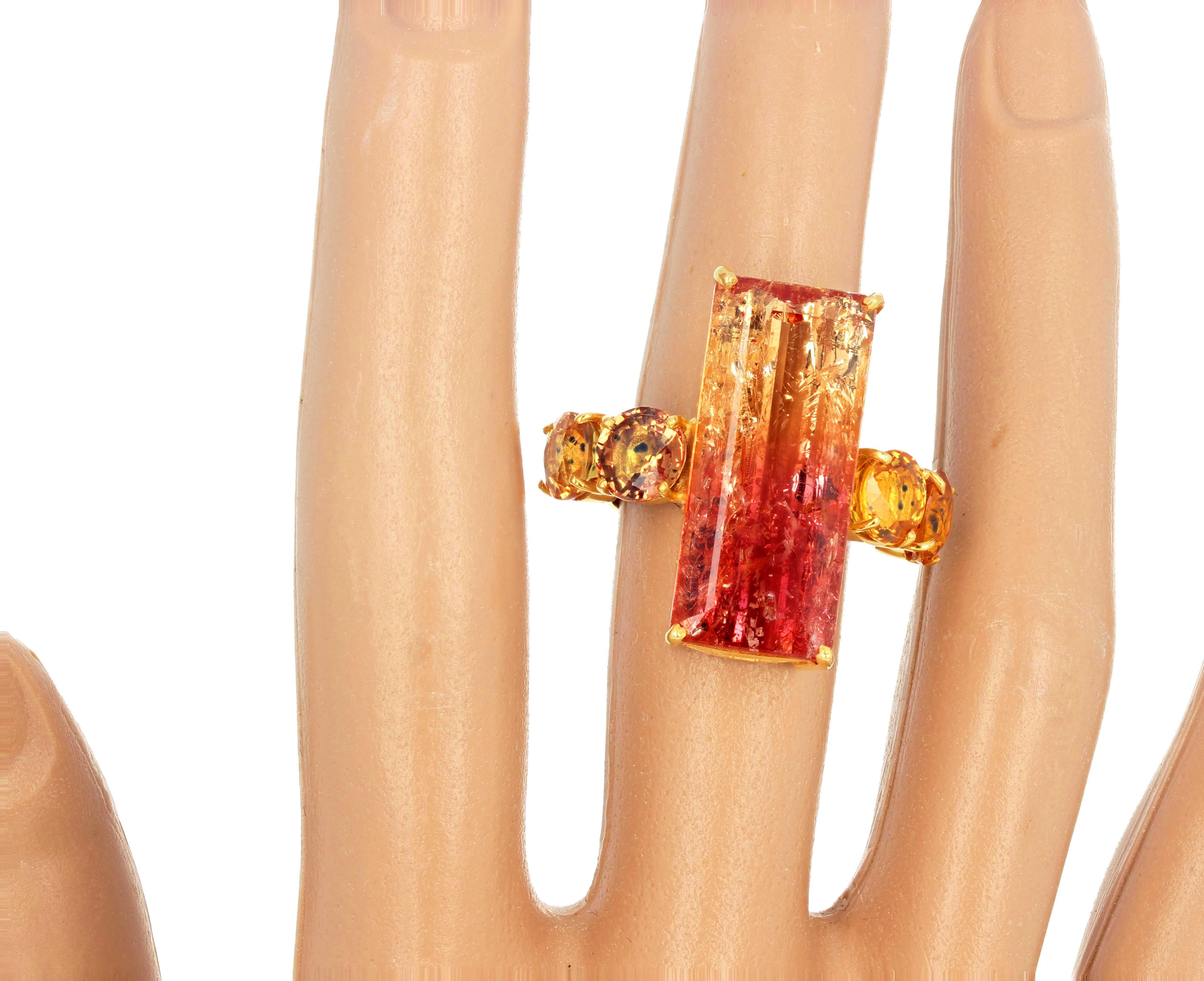 This rare unusual natural magic colors 20.41 carats emerald cut Citrine (25.5 mm x 11.3 mm) is flanked with dazzling bright natural 7mm Songea Sapphires.  The tiny black flecks in the Sapphires authenticate their origin from Songea.  The setting is