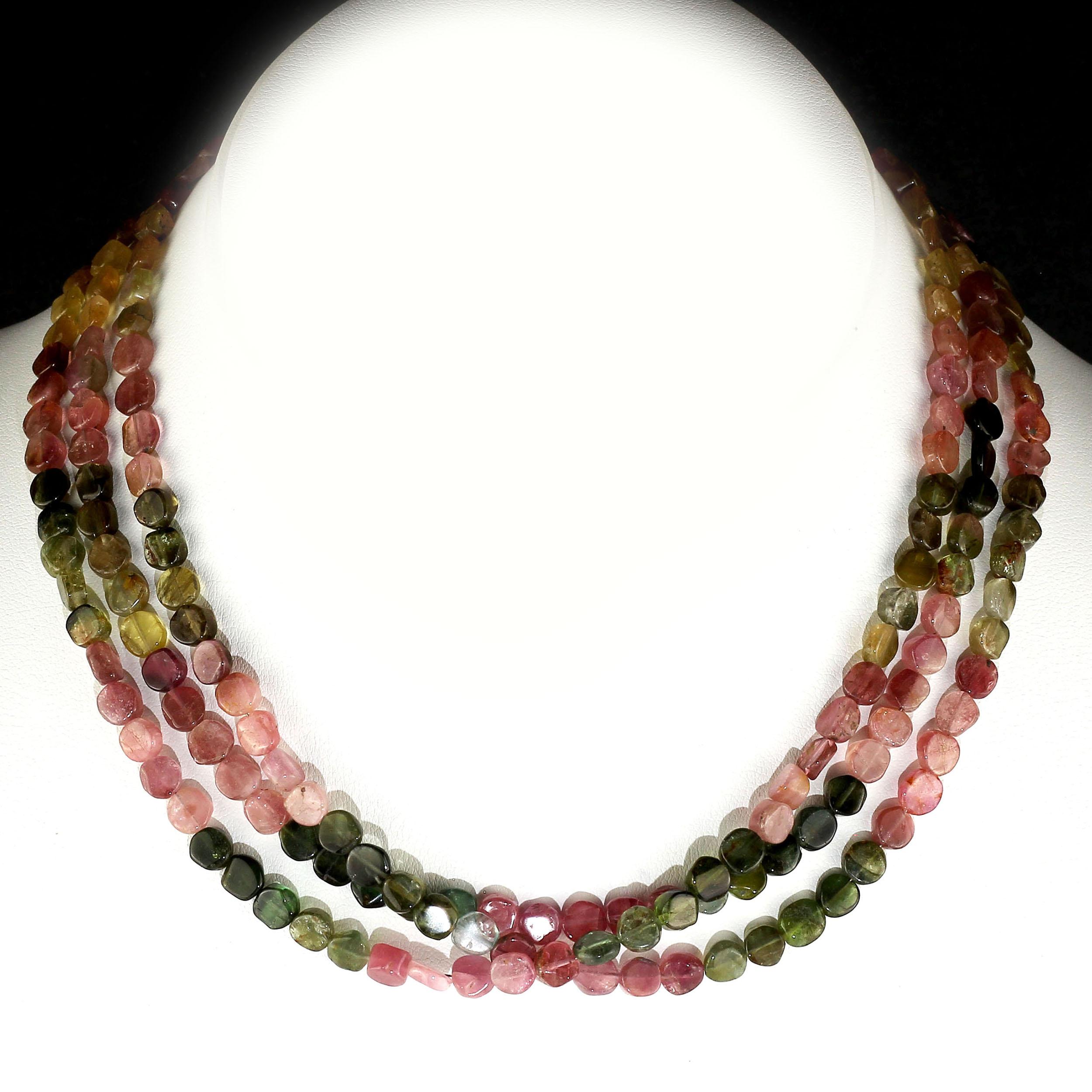 Glowing discs of Tourmalines in all their luscious colors.  These discs are highly polished and in three strands make a very special short choker for all you Tourmaline lovers.  This unique 15 inch choker necklace is secured with a Sterling Silver