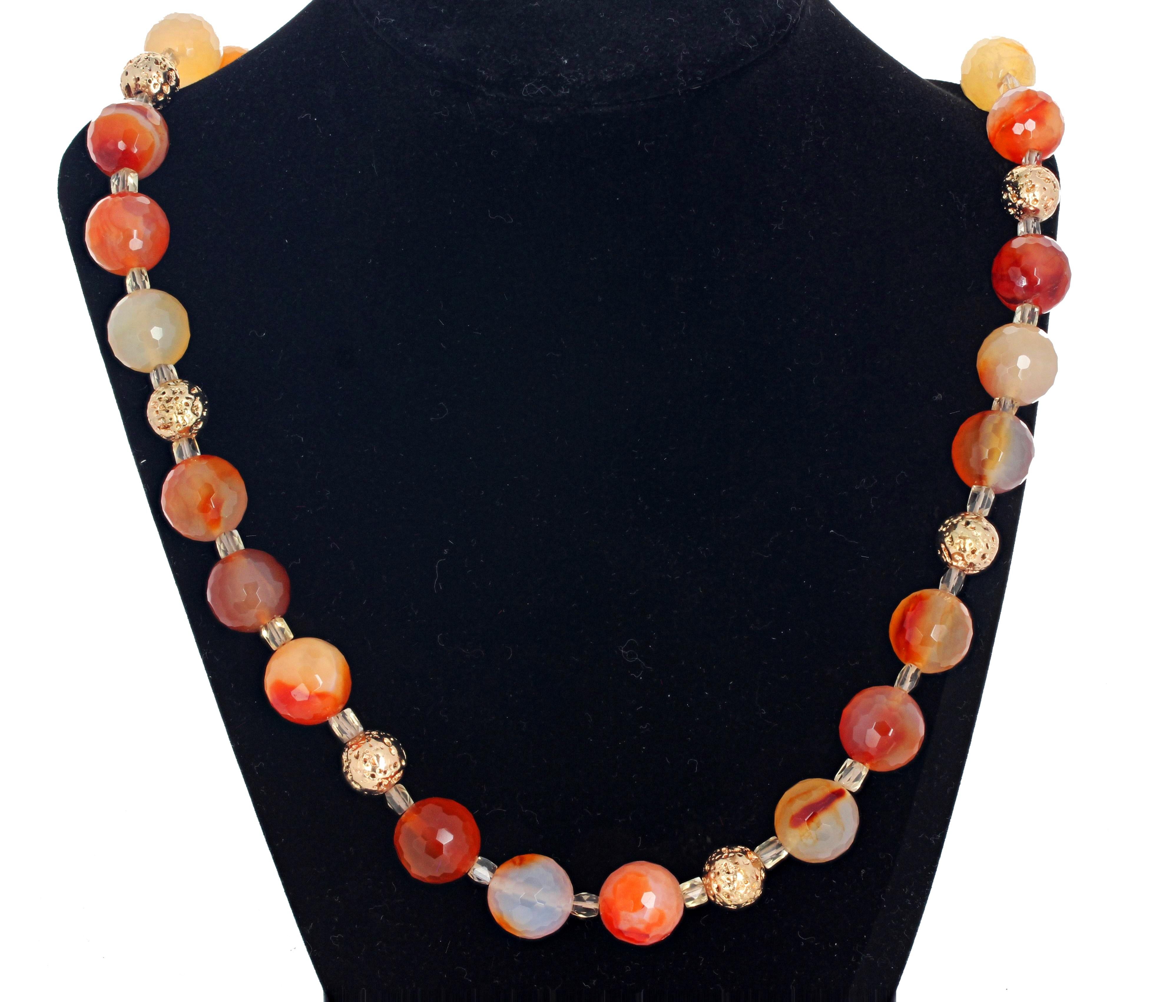 These glittering checkerboard gem cut natural 14mm round natural Fire Agates are enhanced with brilliant gem cut clear citrines and goldy round beautiful Lava Rock.  This elegant necklace is 23 1/2 inches long with a gold plated easy-to-use hook