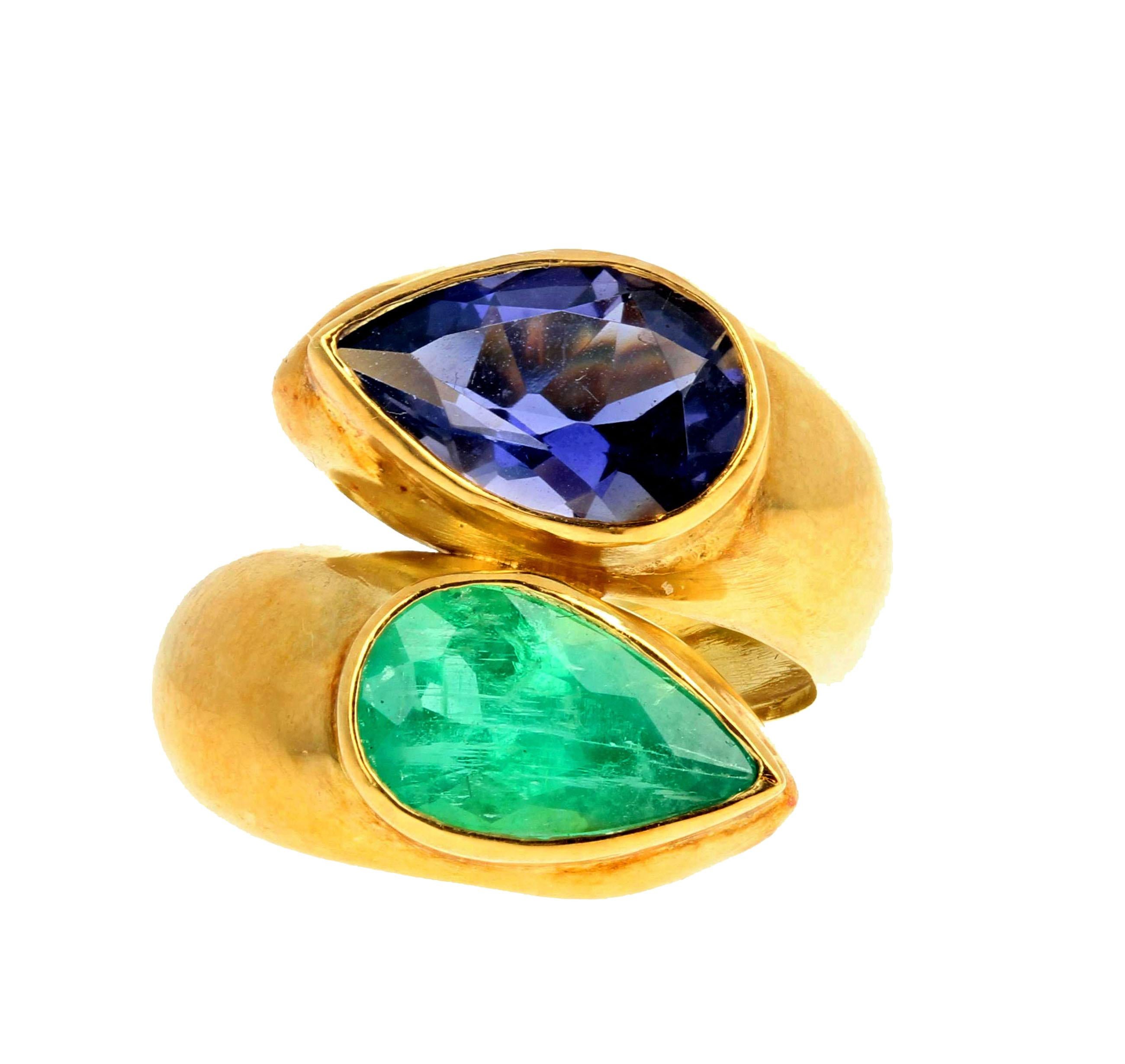 The 2 Carat Emerald 18Kt yellow gold ring is a size 7 (sizable).  Swinging natural bright green emeralds dangle 1.5