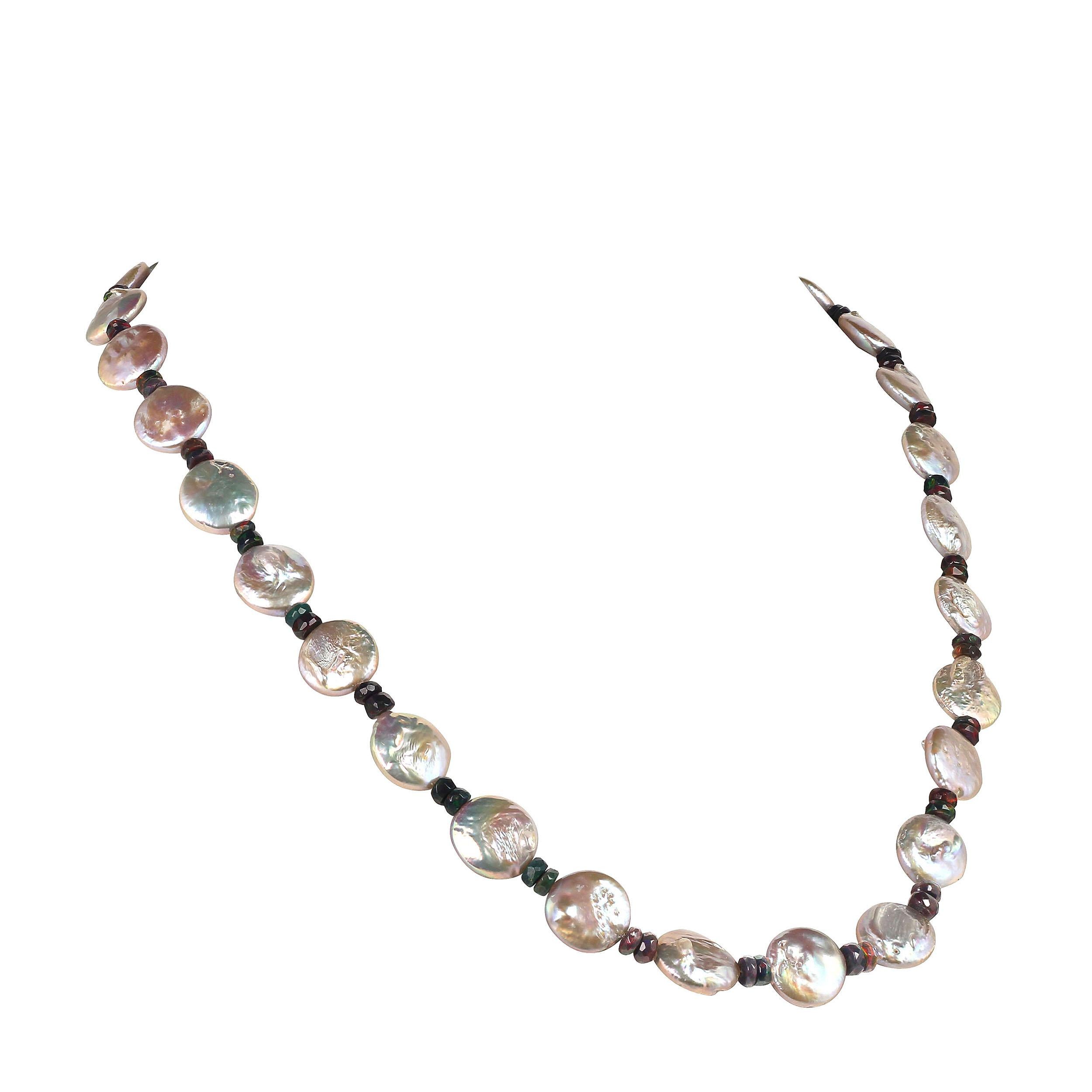 'Because you deserve to own beautiful Pearls'

Stunning iridescent silver Coin Pearls and flashing Black Opal faceted rondelles complement  each other in this lovely 22 inch necklace.  The Black Opals, 5MM, are various shades of black, red, and