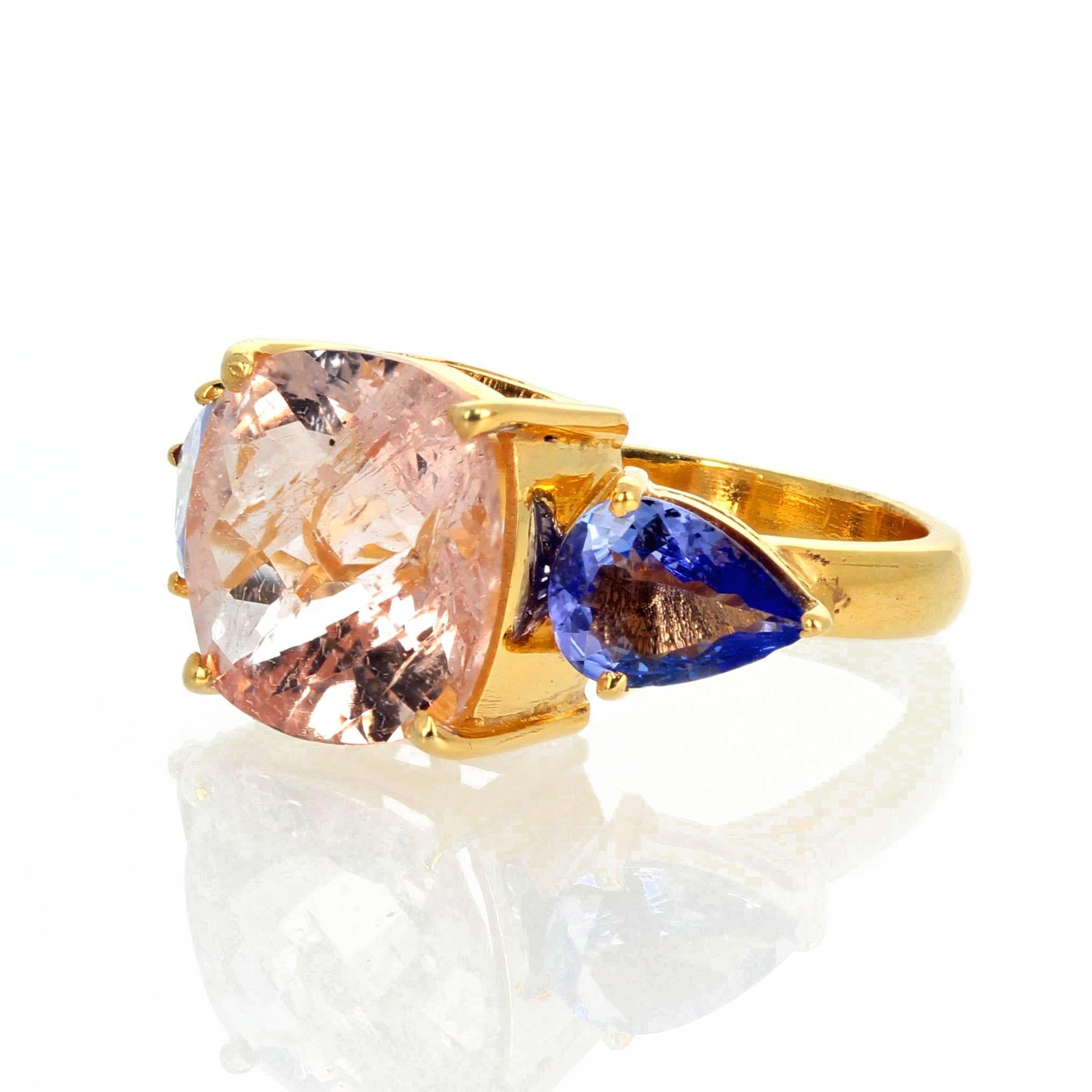 This gorgeous sophisticated Checkerboard gemcut 6.25 carat blush pink natural Morganite (12 mm x 12 mm) flanked by 1.92 carat trillion cut real blue Tanzanites.  This ring is sterling silver yellow gold plated size 7 (sizable for free).  This modern