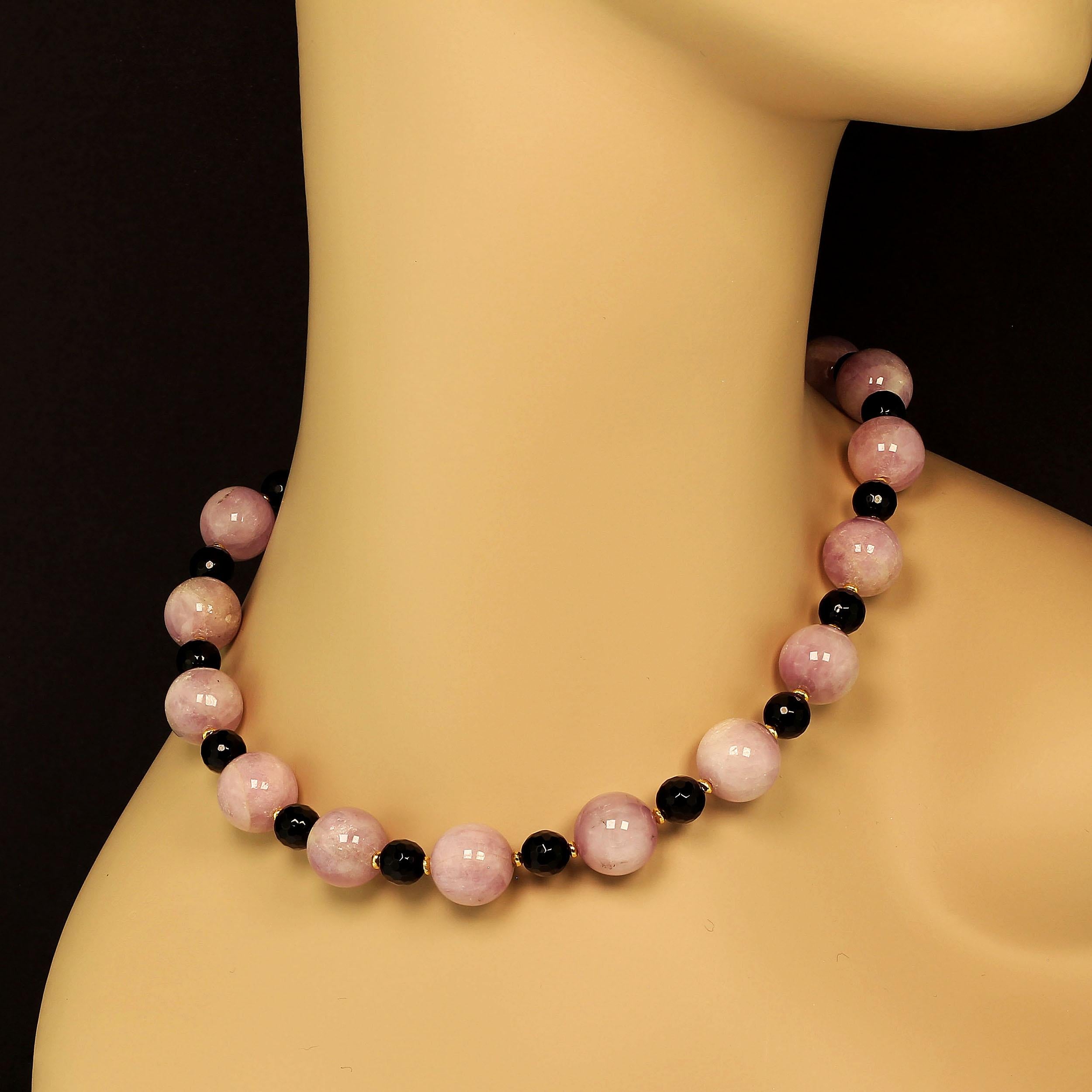 Highly polished 14 MM opaque Kunzite is combined with faceted sparkling Black Onyx, 8MM in this stunning, custom made necklace.  Gold tone accents set off these gem quality Kunzites and Black Onyx.  This unique 18 in necklace is secured with a gold