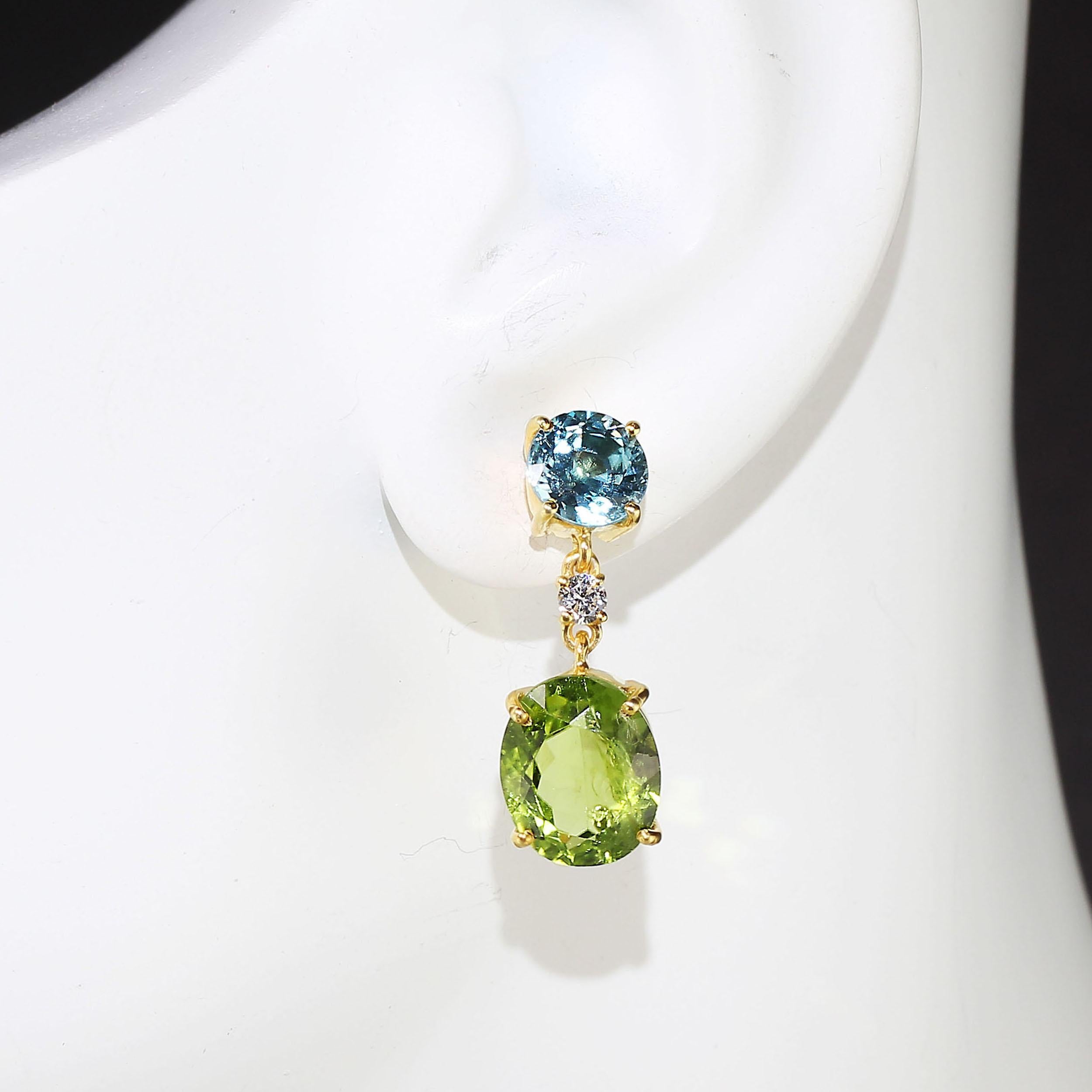 Ear Swag!! Sizzling Earrings of sparkling Green Peridot and neon Blue Zircons. These jewels are a must for every fun loving earring wearer! The bright blue Cambodian Zircons are set with push back posts. From the Blue Zircons are hung clear Zircons