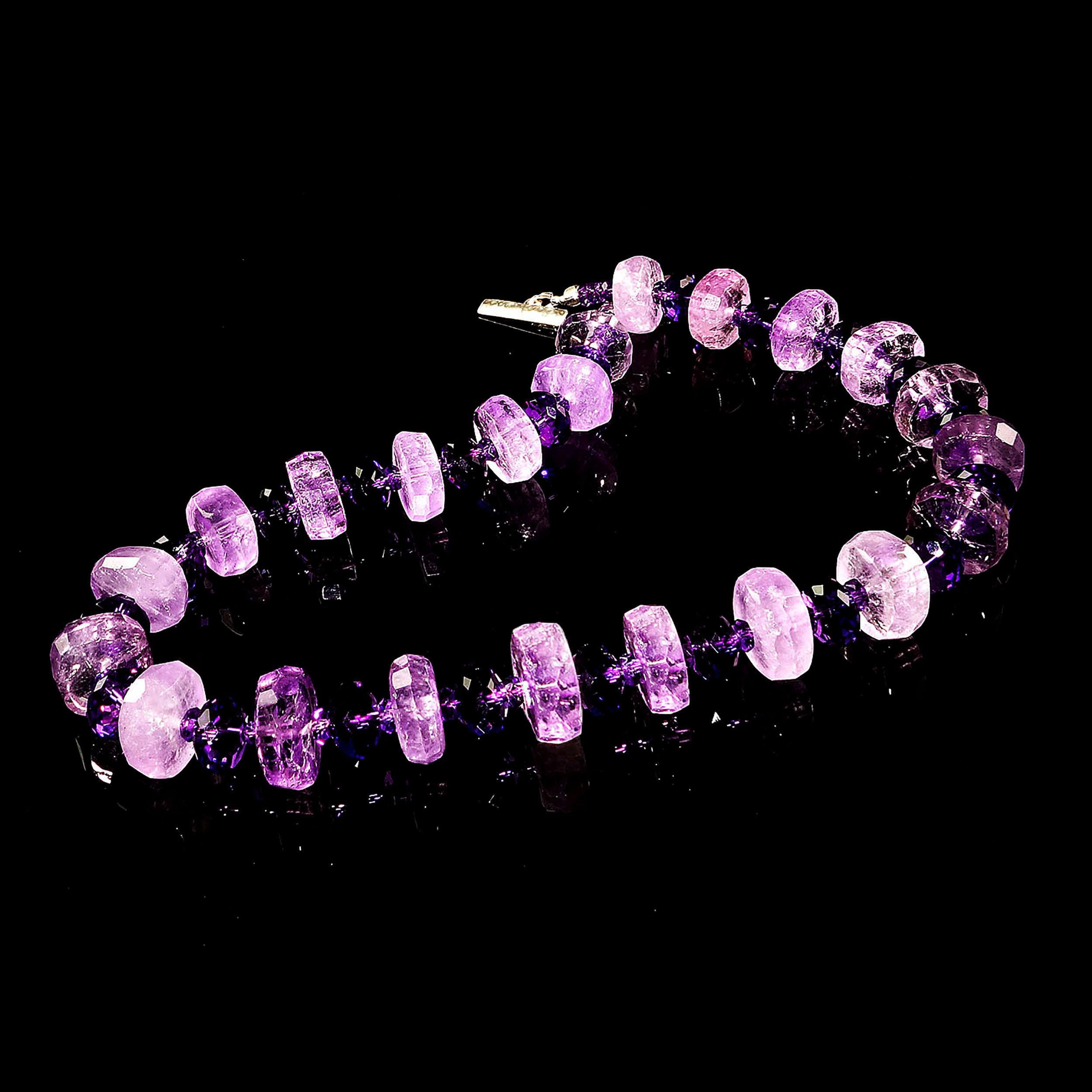 Handmade, unique necklace of rondels of larger, lighter Amethyst and alternating with fully faceted darker Amethyst in two sizes.  The larger Amethyst are 14 MM with flat sides and faceted edges.  The 10 MM darker sparkling Amethysts are fully