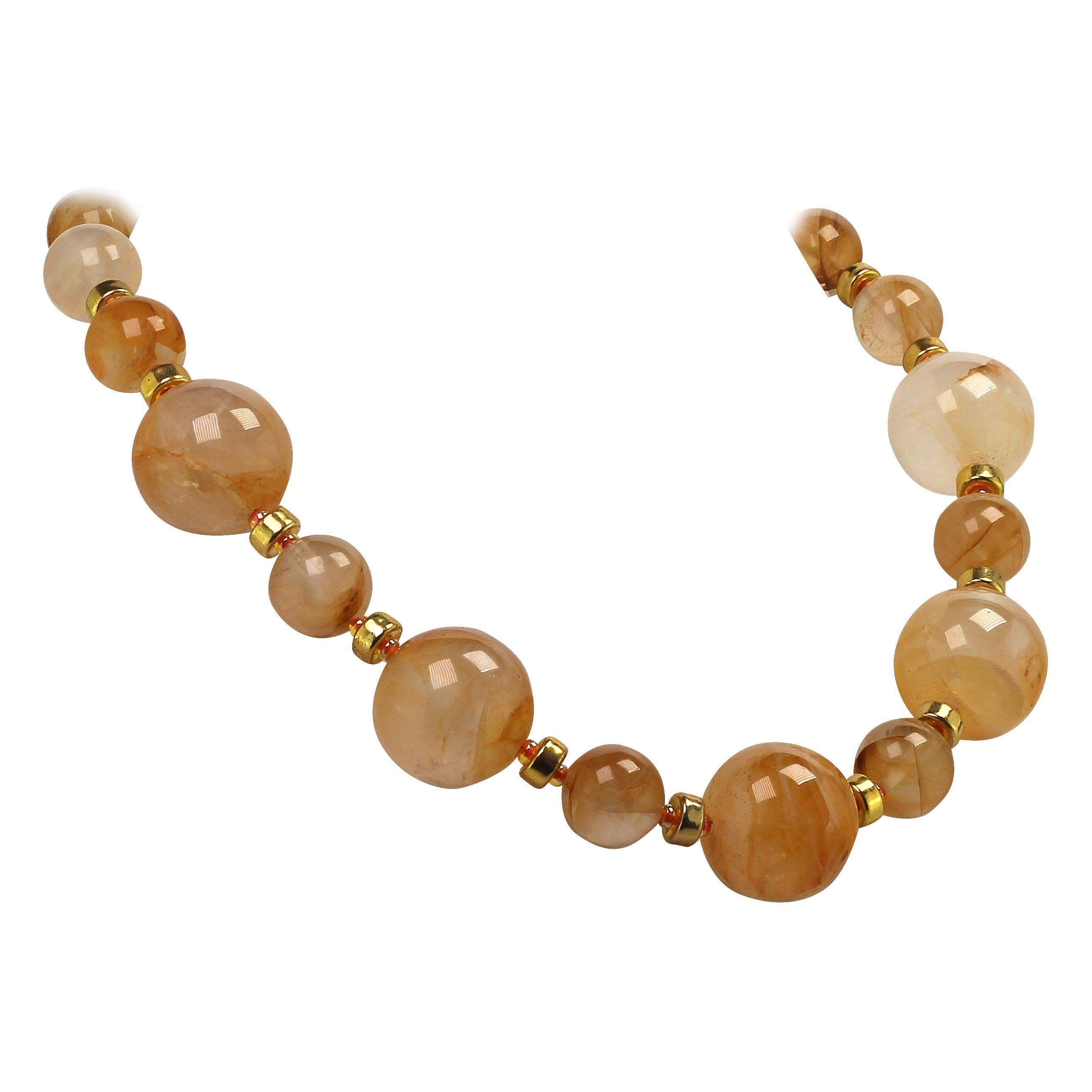 Magnificent Gold Quartz Necklace featuring two sizes of these incredible beads, 25 MM and 16 MM. Each bead is unique.  This custom made necklace features gold tone accents as well as orange Czech crystal beads and a vermeil toggle clasp.  This is a