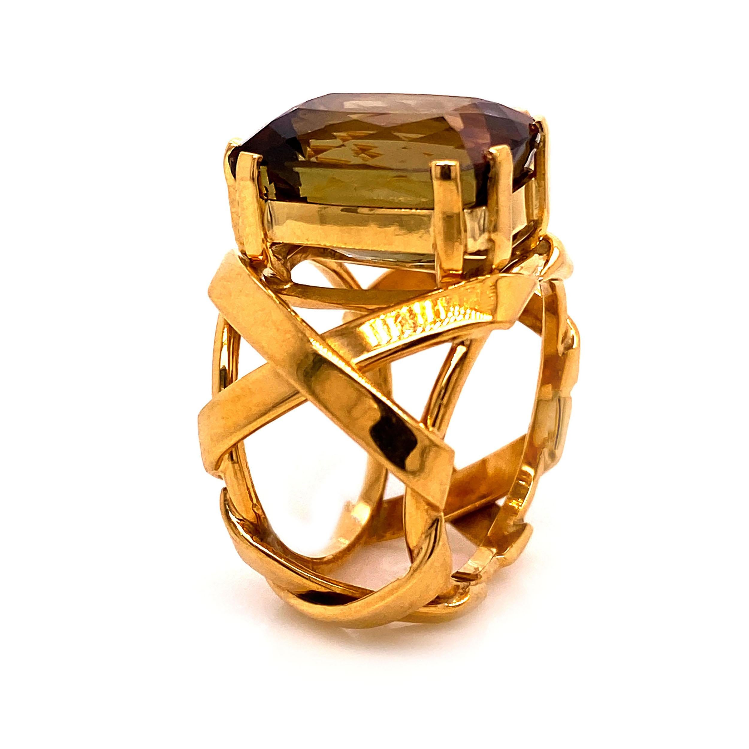 Perfect for Fall.  This Statement Ring of huge Andalusite, 15 X 10 MM, set on top of the ancient 'X' pattern in 18K rich yellow gold is a true show stopper.  Andalusite is strongly pleochroic and can show shades of green, brown, and red when viewed