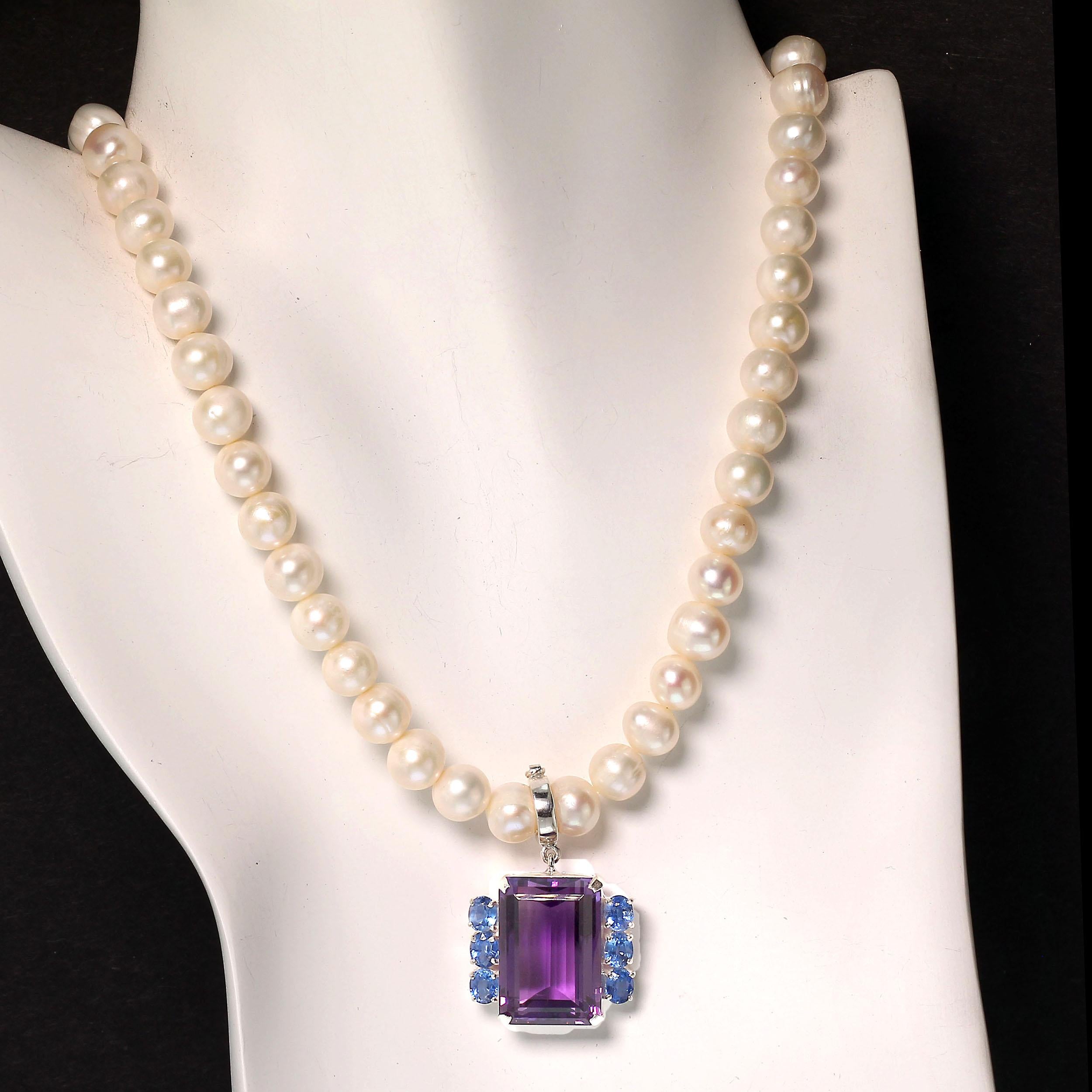 This is a gorgeous emerald cut Amethyst with accents of sparkling blue Kyanites pendant. This pendant is such a nice size and the unusual color combination makes it distinctive and unique. The hand made Sterling Silver setting features a hinged bail