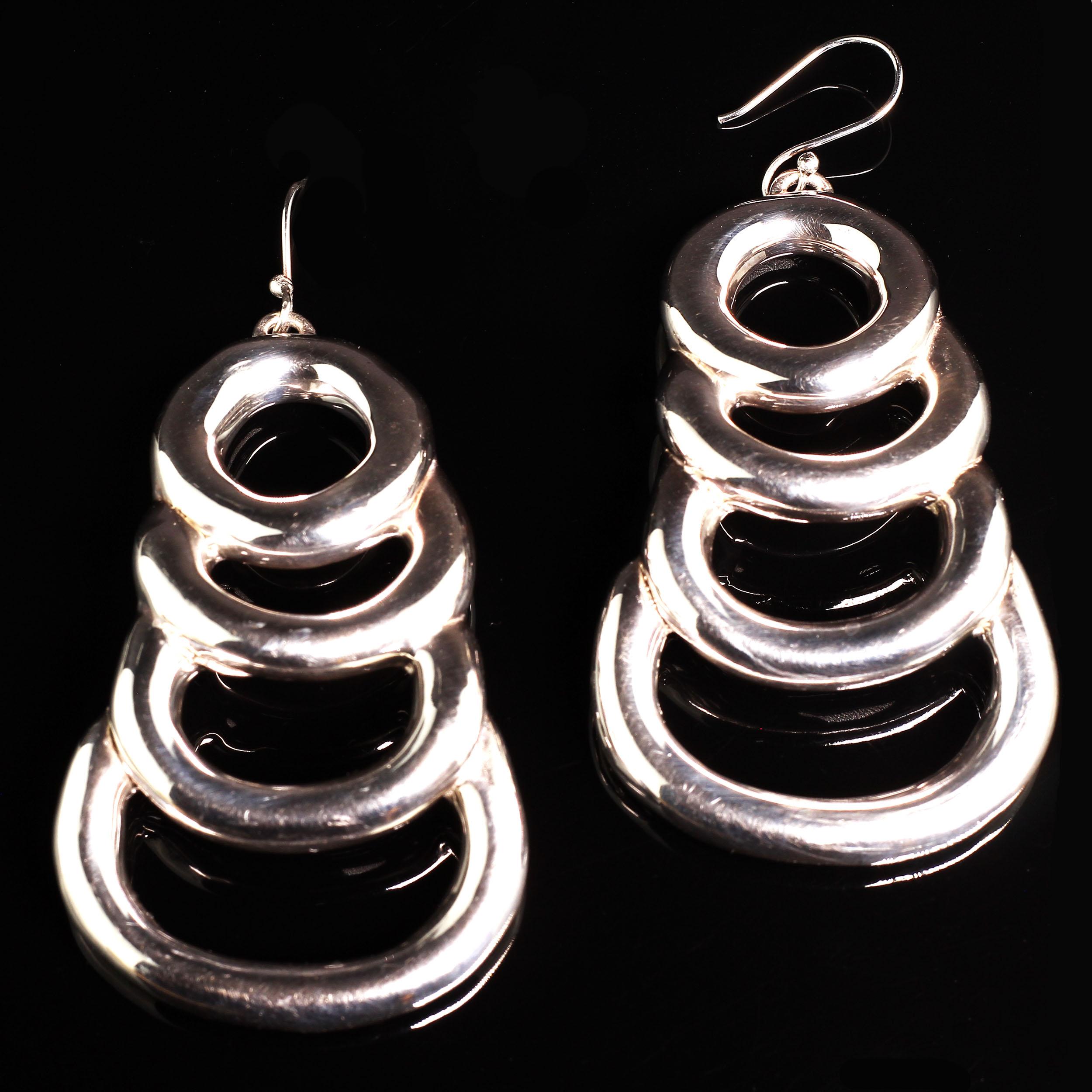 
These earrings are perfect to wear while you're teleconferencing! And, they are available for immediate shipment.
These Sterling Silver Dangle earrings make a striking statement wherever they are worn. They are three inches long from the top of the