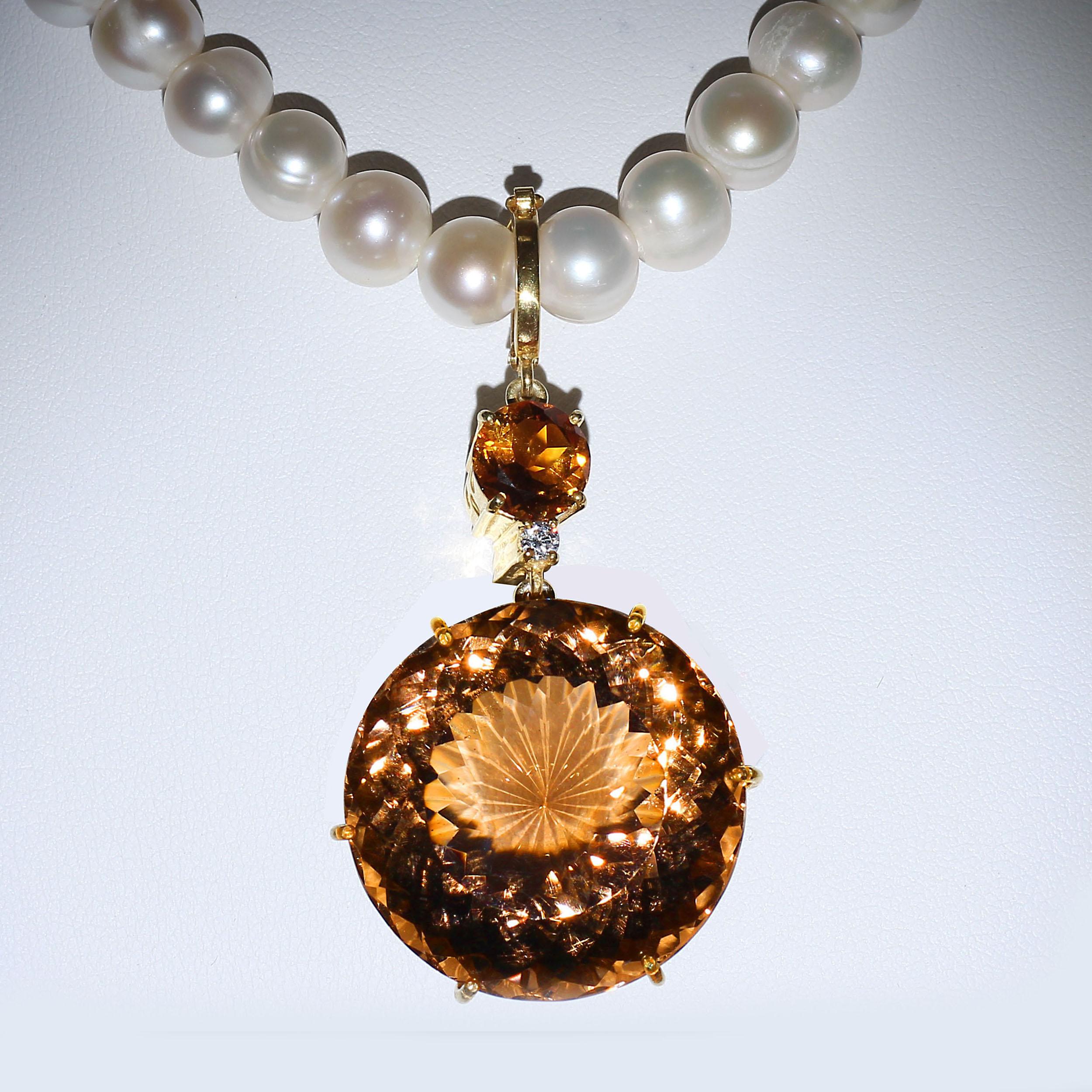 Eye popping pendant of huge, round Smoky Quartz accented with a sparkling Citrine and Cambodian Zircon. This gorgeous pendant is just perfect for Fall. Gorgeous Smoky Quartz, sparkling Citrine, what's not to love? The gemstones sit in their own hand