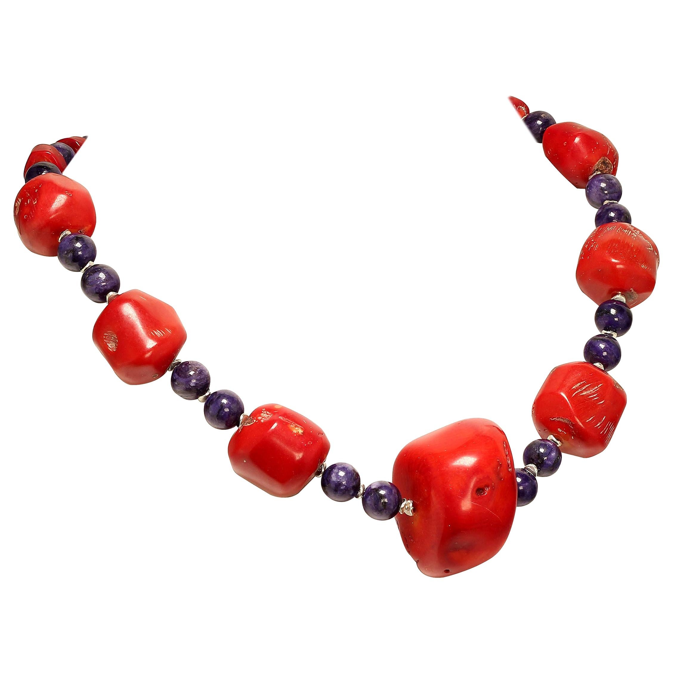 Unique and elegantly stylish Coral and Charoite necklace. Your first question is 'what is charoite?' Charoite is a lovely purple Russian mineral from the Chara River region, hence the name. It can be veined and mottled and have distinctive markings.