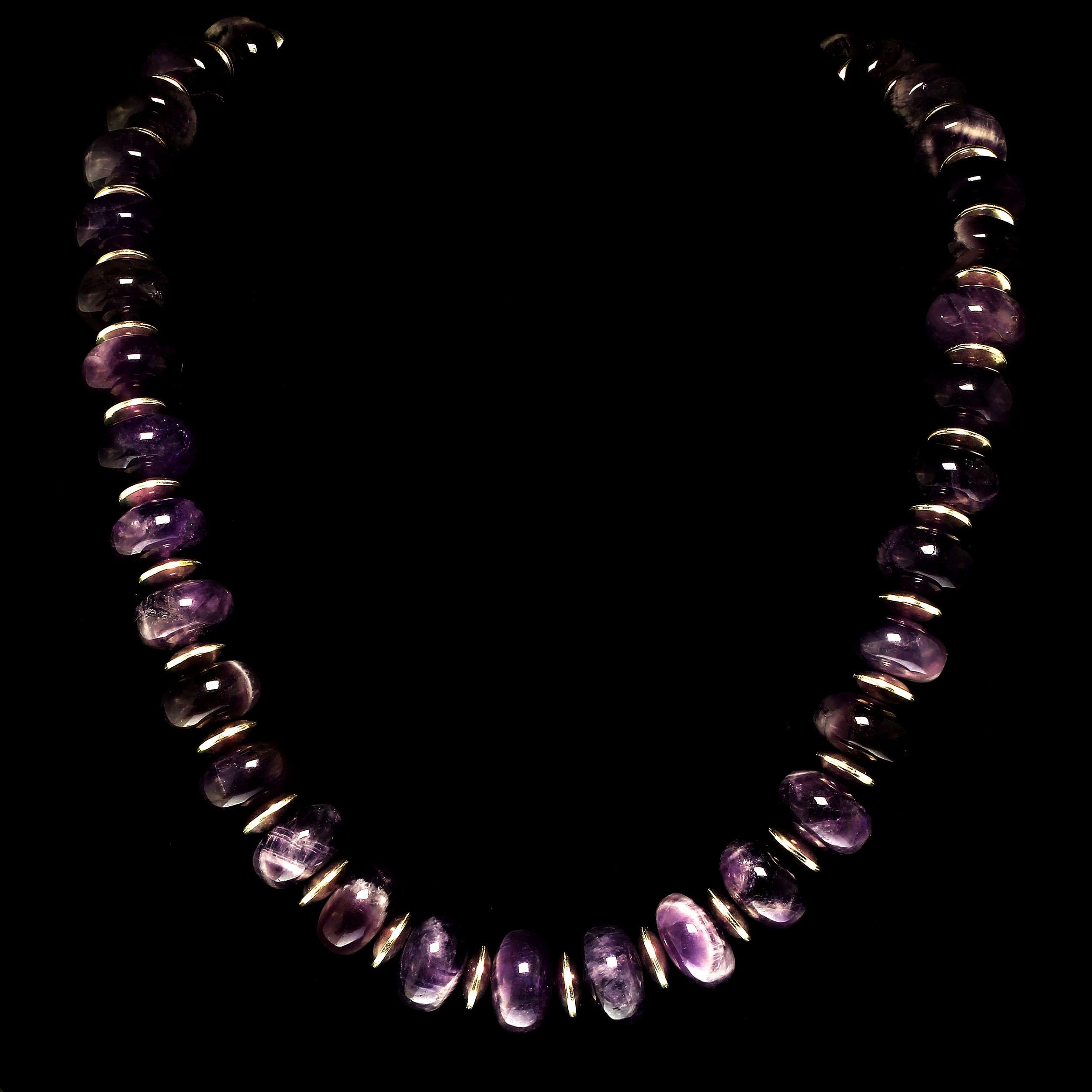 16 MM Highly Polished Cabochon Rondelles of Amethyst in Matrix necklace. The Amethyst is accented with 10 MM silver tone enhancers and secured with a Sterling Silver Toggle clasp. The necklace is 27 inches in length. Amethyst is the February