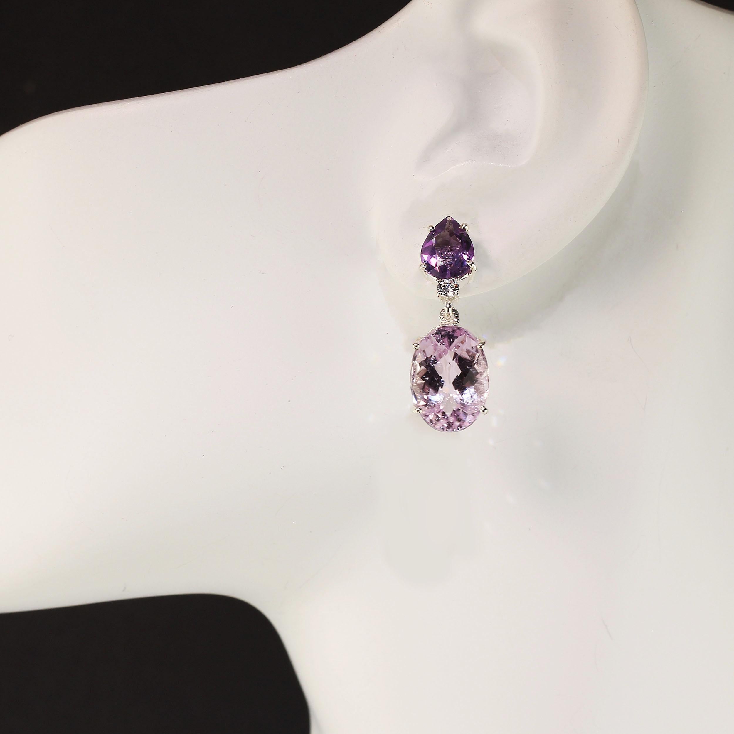 Wear these happy, warm earrings from day to evening.  Lively pink Kunzite ovals swing from pear shaped Amethysts. A sparkling Cambodian Zircon sits just beneath the Amethyst to further enhance the overall look of these one inch long earrings. These