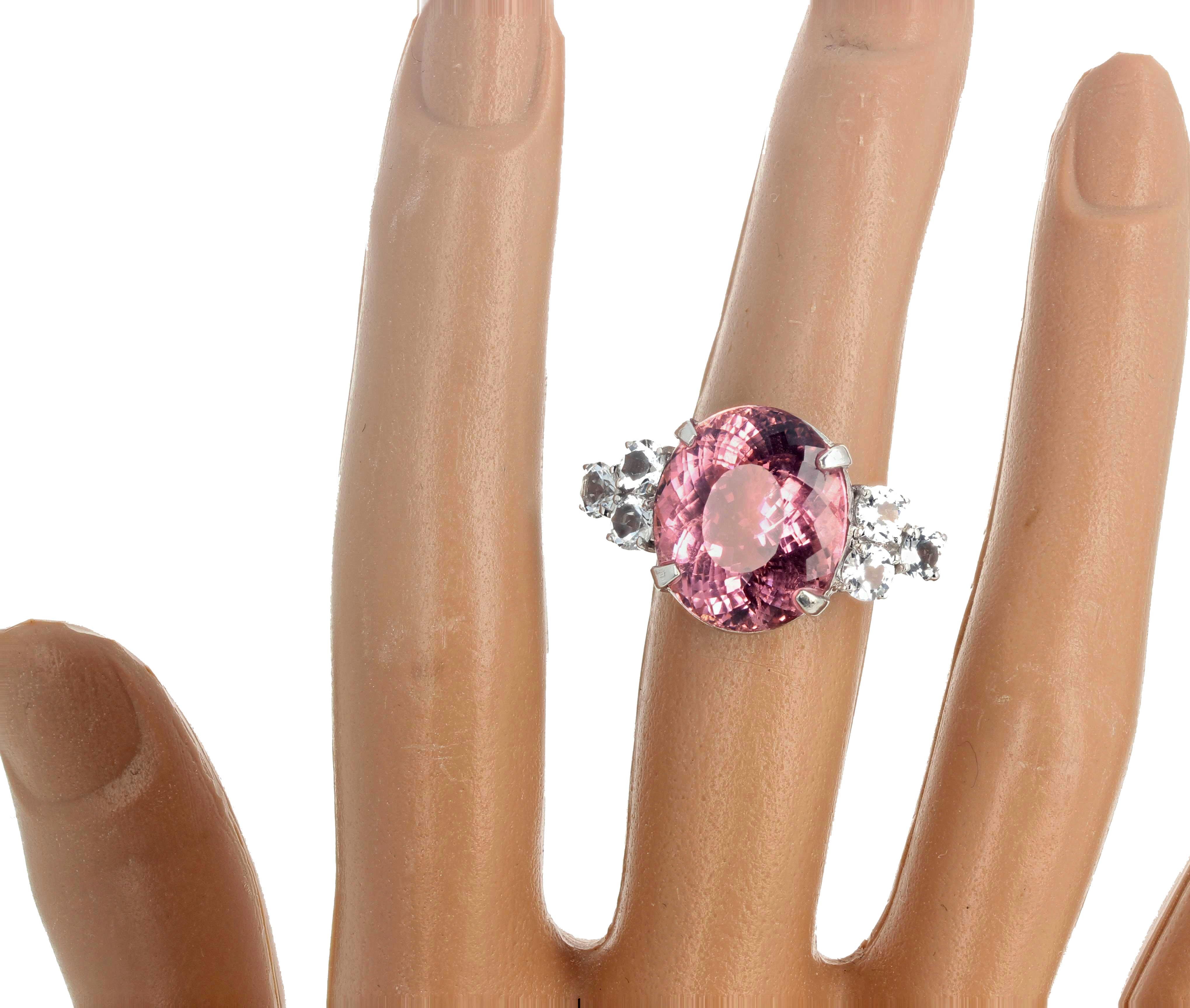 This magnificent 14.38 carat center natural sparkling pink Tourmaline gemstone is offset by six sparkling 1.71 carats of natural white Cambodian sparkling real Zircons.  There are NO eye visible inclusions in this beautiful Tourmaline set in this