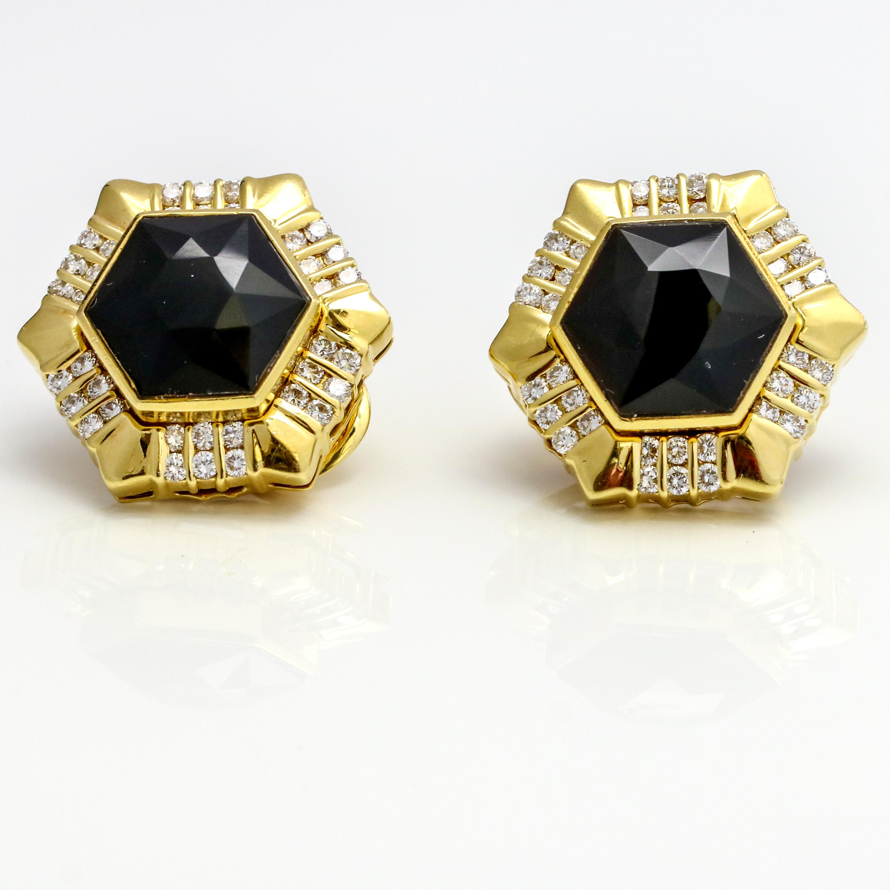 Gemlok hexagon clip-on stud earrings with diamonds and exchangeable gemstone centers in 18-karat yellow gold. The set includes faceted black onyx centers, and black mother of pearl centers. The earrings have 72 round diamonds.

Centers, 12 mm x 14
