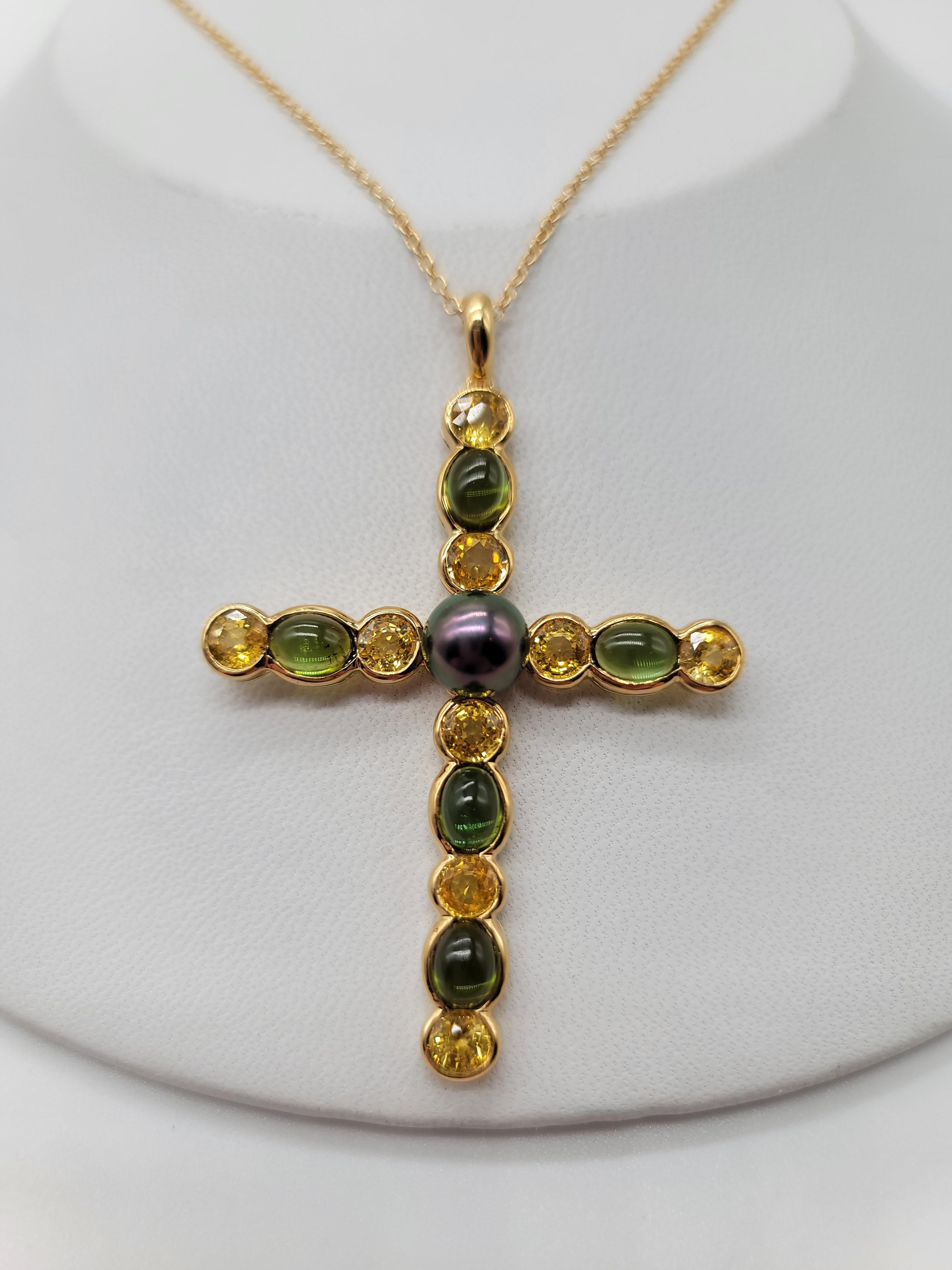 What a show stopper. The combination of 4.33 carats of vivid Cabochon cut Green Tourmalines with 5.13 carats of equally beautiful Yellow Sapphires finished off with a lustrous Black Pearl really makes this piece stand out as unique!!!! Chain