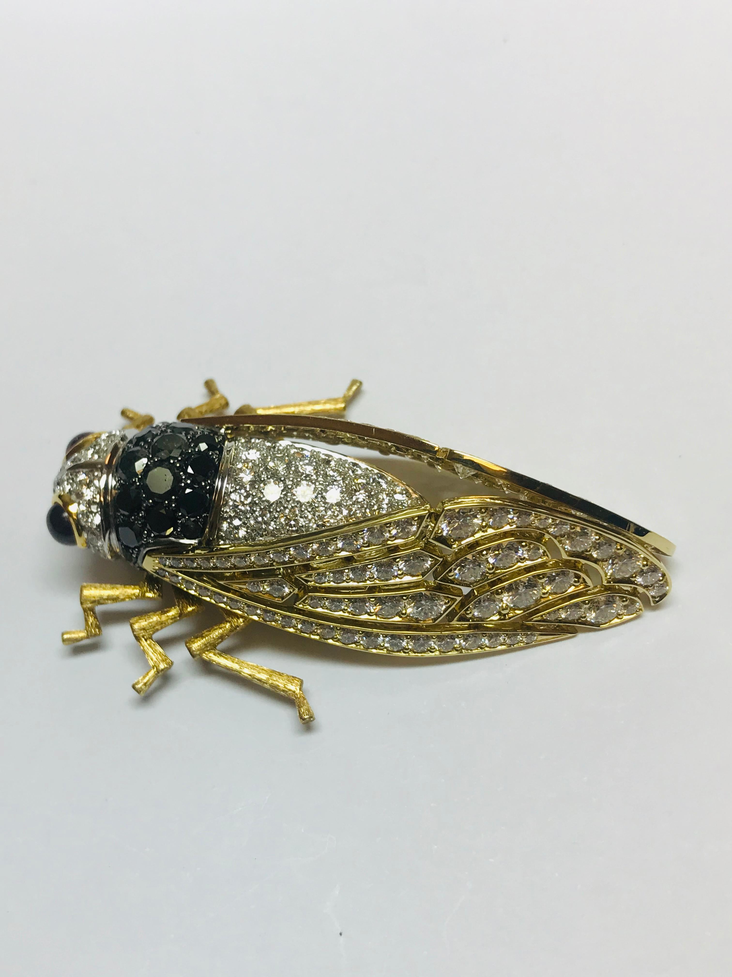 This absolute work of art looks so real it's incredible!!! All set in 18k yellow and white gold, this one off Cicada brooch contains 6.45 carats of G+ VS clarity white diamonds with 1.60 carats of black diamonds and is finished off with beautiful