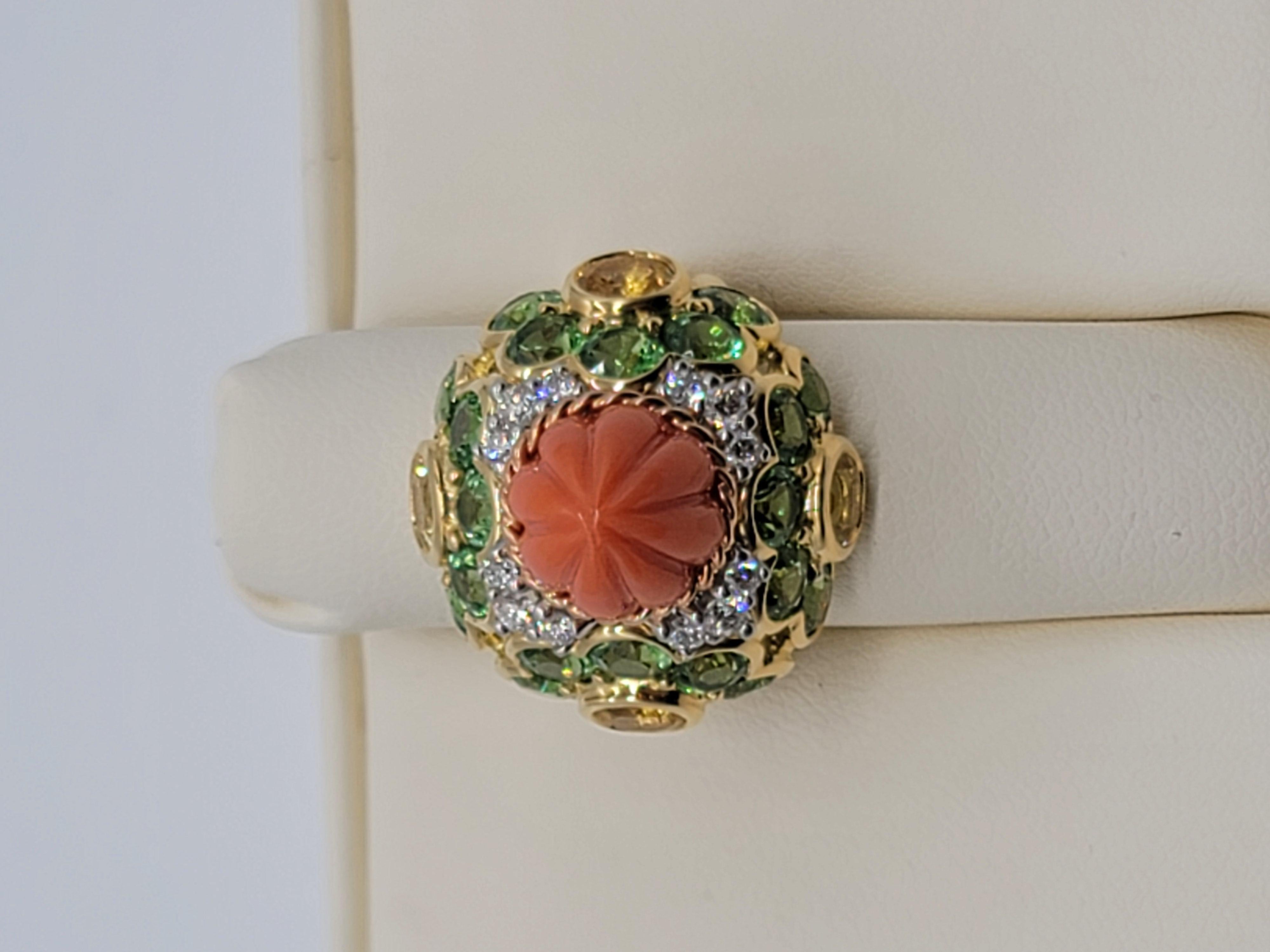 This unique, one of a kind creation combines a removable twist off carved Coral top ( allowing for versatility for many options of gemstone tops ) with 2.60 carats of Yellow Sapphire, 6.00 carats of Tsavorite Garnet and .45 carats of Diamond. The