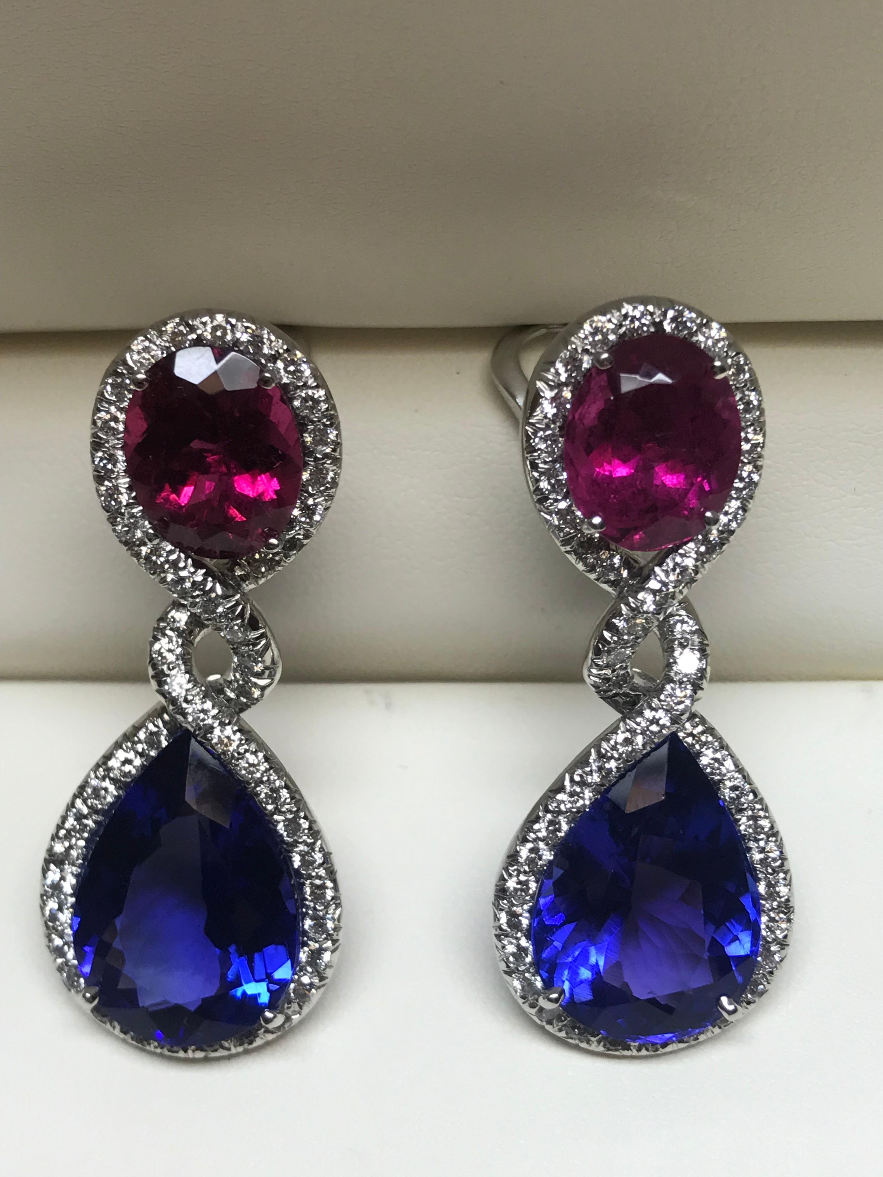 A MUST for any true GEM lover. These absolutely one off stunning earrings consist of 25.52 carats of perfectly matched gem quality Tanzanites and same quality 9.70 carats of Rubellites. Highlighting these incredible stones are 2.30 carats of G+