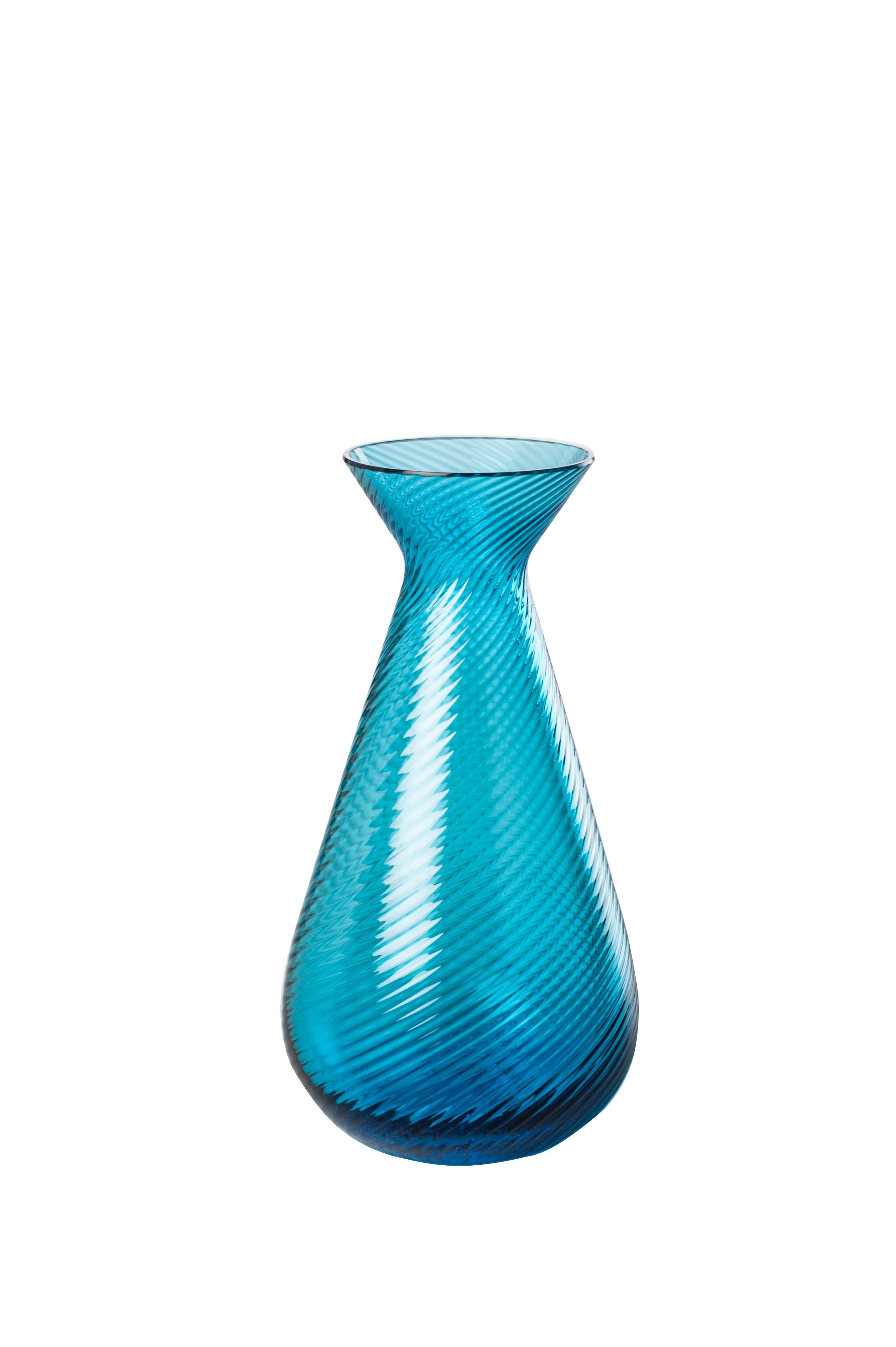 Venini glass vase with shaped body and neck in aquamarine designed in 2017. Perfect for indoor home decor as container or statement piece for any room. Also available in other colors on 1stdibs.

Dimensions: 8 cm diameter x 15.5 cm height.
