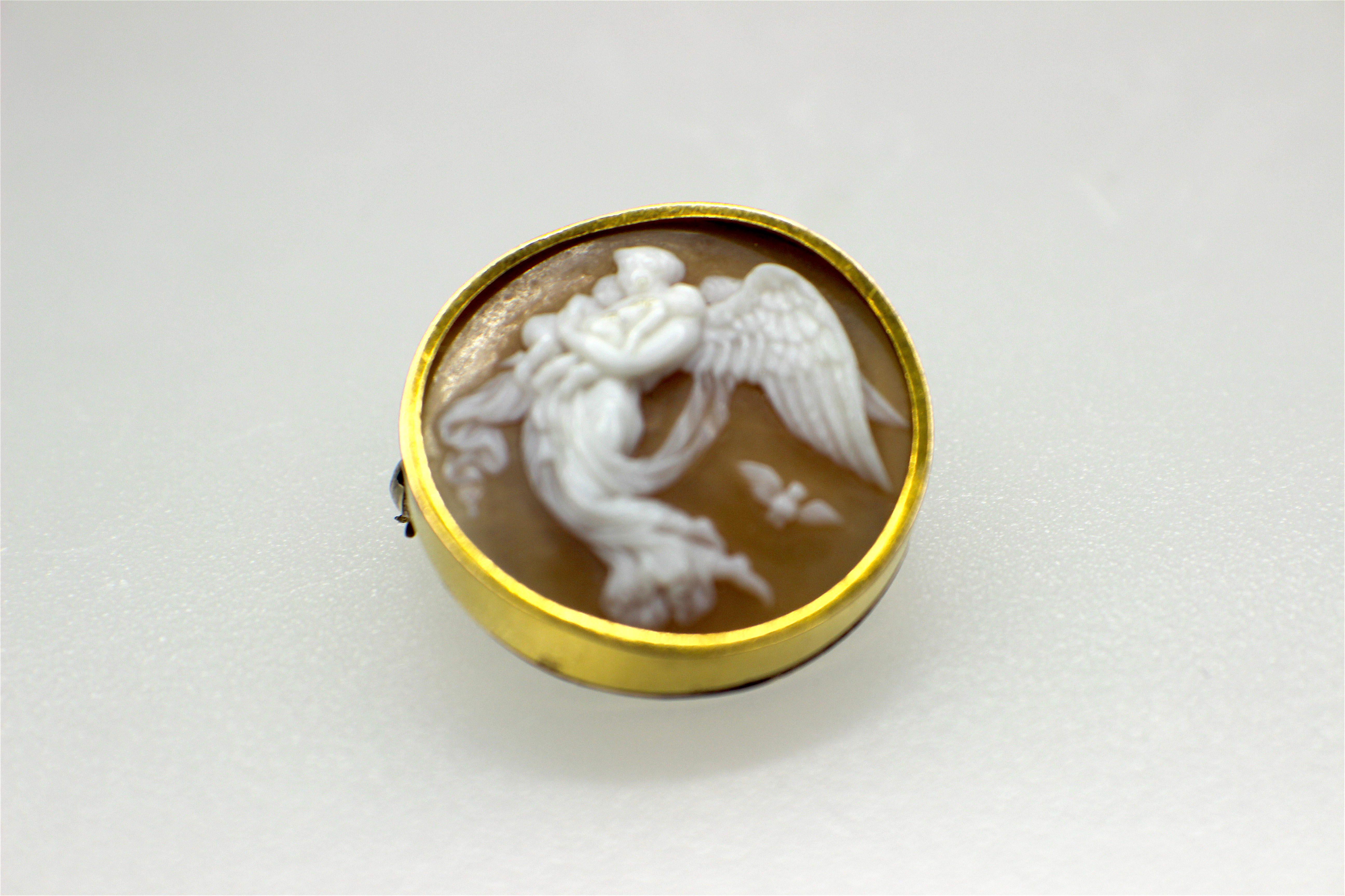 GEMOLITHOS Antique Shell Cameo Gold Brooch-locket, circa 1870s, 5,4gr. and circa 2,5cm. 
depicting `The night of Thorvaldsen`. The reliefs Night and Day that hang opposite each other at the Museum of Thorvaldsen, are Thorvaldsen’s most popular