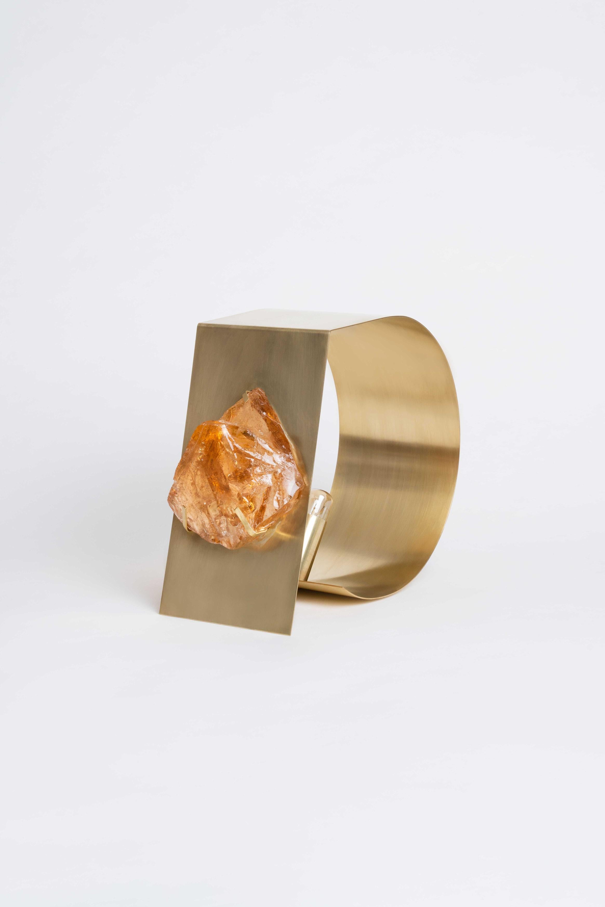 Gems Ambre table lamp by Marie Jeunet
Dimensions: w 13 x d 24 x h 23.5 cm
Materials: Amber crystal and brushed brass.

Gems Collection
At the border between art and goldsmithing, this collection invites the world of jewelry to sublimate our
