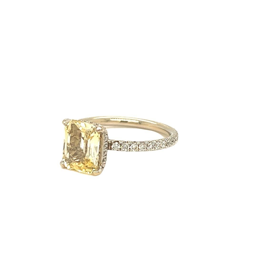 Designed and crafted by Gems Are Forever Inc. in Beverly Hills. This modern classic ring features a 2.65 carat rectangle shaped yellow sapphire. The center stone measures 7.11 x 8.81 x 4.09 mm. The ring is handcrafted with a hidden diamond hidden