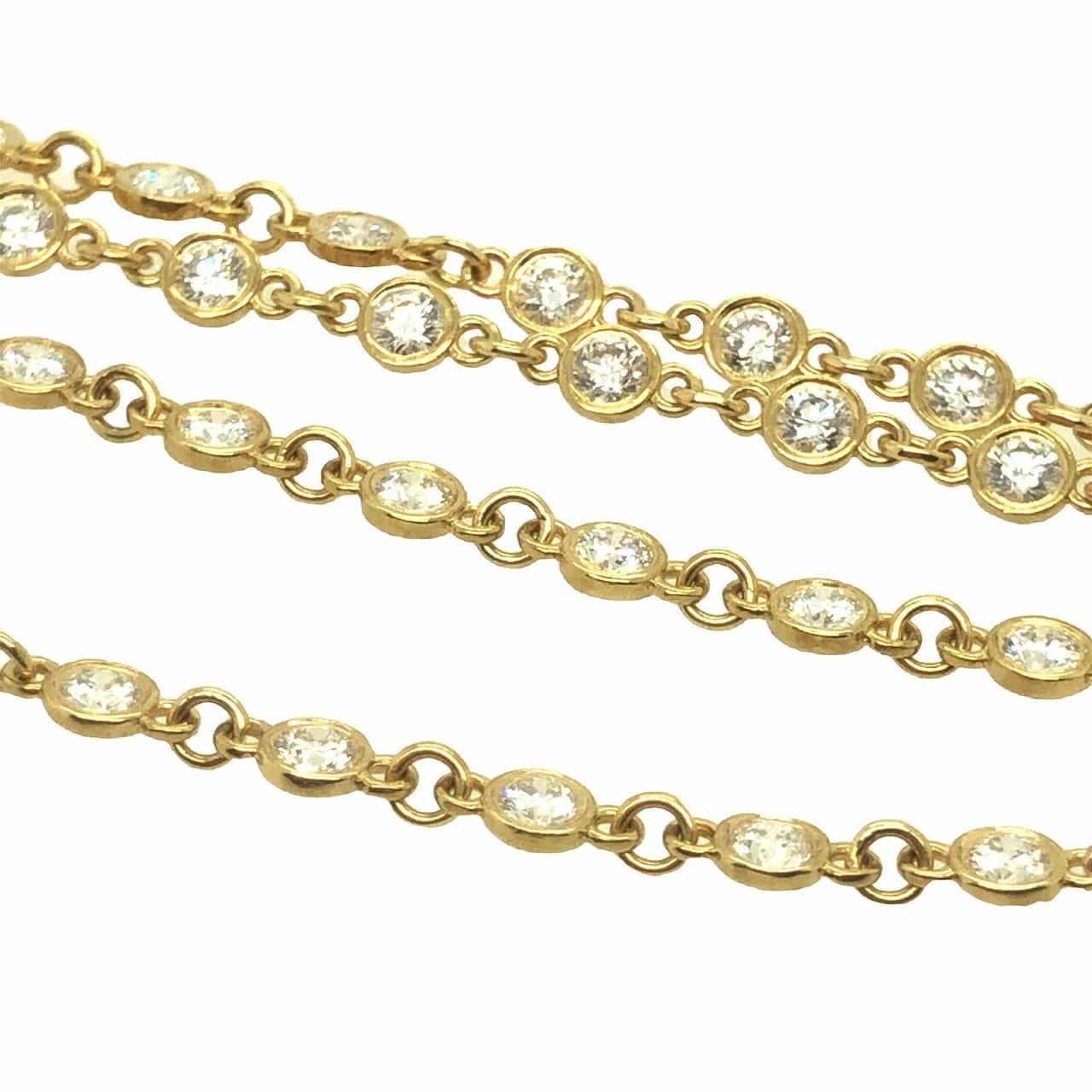 Bezel set diamond link necklace features 60 round brilliant cut diamonds, total weight of 3.25 carats, F-G VS quality.  It is handcrafted in 18K yellow gold. The chain has smooth movement and will beautifully drape on your neck. It measures 16