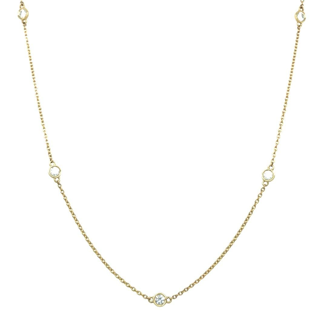 Designed and handcrafted by our team at Gems Are Forever, Beverly Hills. This classy and beautiful necklace has 8 diamond stations that are set in 18 karat yellow gold bezels and connected with 18 karat yellow gold cable chain. The total weight of