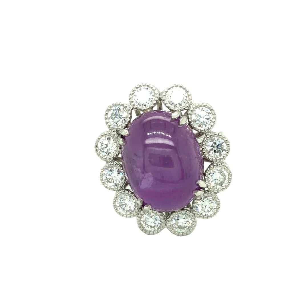 Designed and hand crafted by Gems Are Forever, Beverly Hills. This statement piece showcases an oval shaped 16.33 carat pinkish purple star sapphire at center. The center stone is certified by GIA and held in by 4 sets of double crawl prongs and is