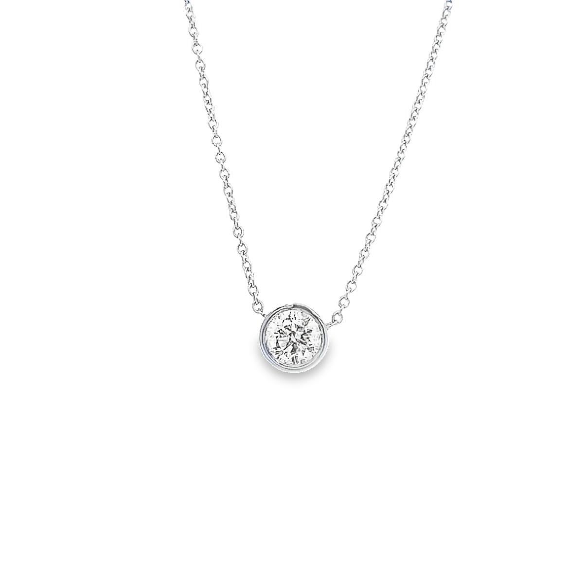This elegant diamond necklace can be worn as an everyday 