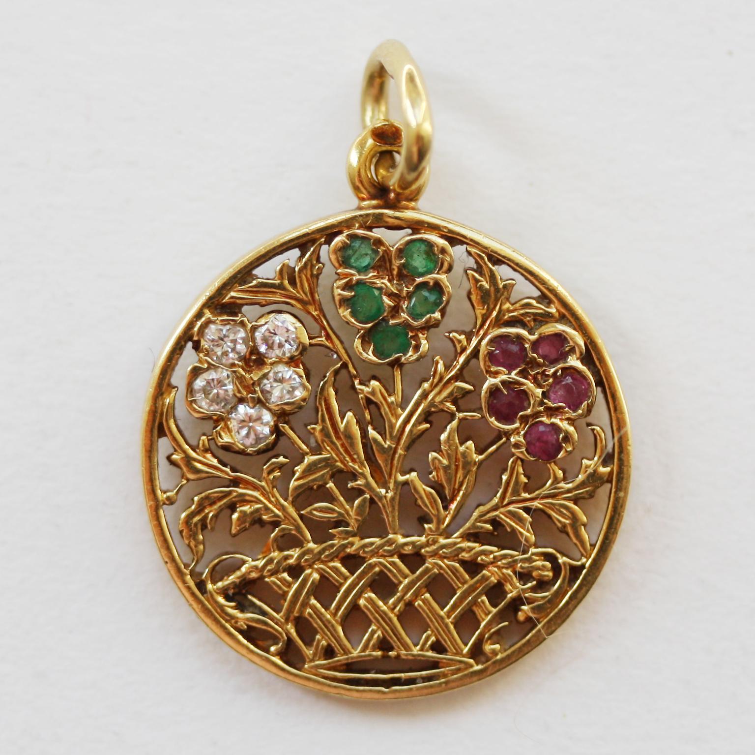 An 18 carat gold open worked charm with three pansies in a basket, each pansy has five petals, with diamonds, emeralds and rubies respectively, most likely French.

weight: 4.90 grams
dimensions: 2.6 x 1.9 cm.