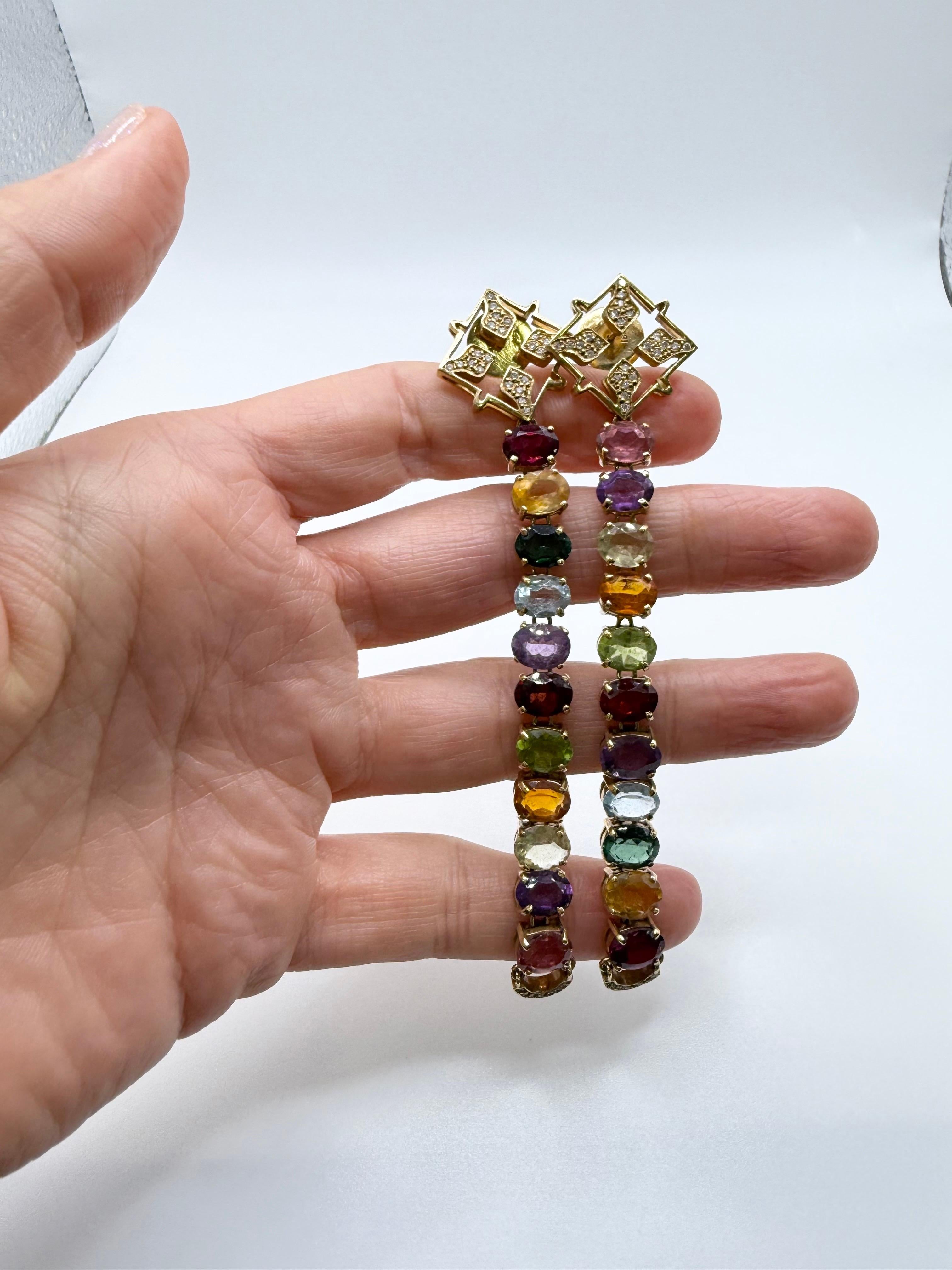 Stunning pair of earrings with multiple gemstones, sapphires, semi-precious gems and diamonds made in 18KT gold. 

**All items leave our premises with a certificate in buyers name, company policy! This insures security for you and us, it is also