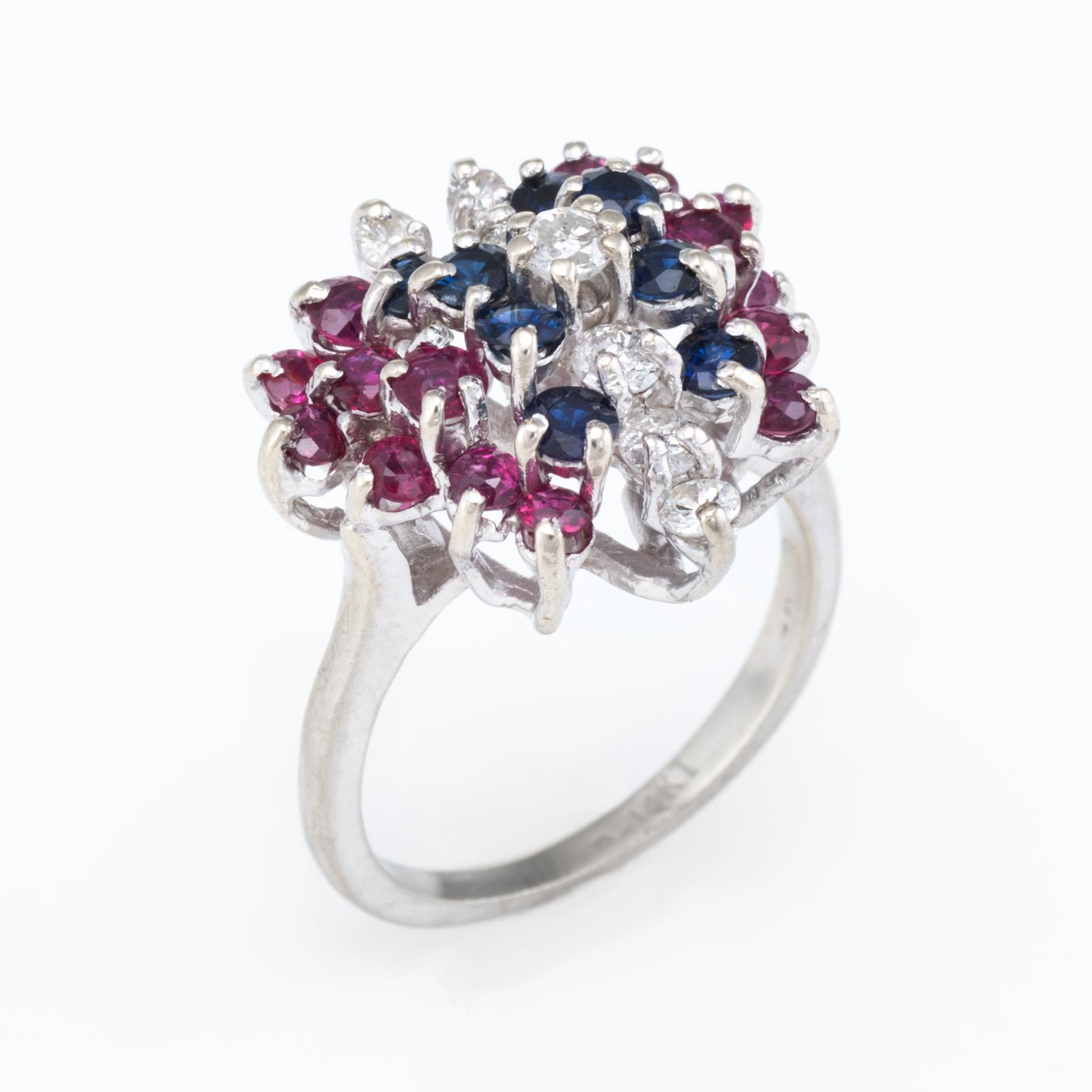 Finely detailed butterfly cocktail ring, crafted in 14 karat white gold. 

Round brilliant cut diamonds total an estimated 0.50 carats (estimated at I color and SI1-2 clarity), accented with an estimated 1 carat of rubies and 1/2 carats of