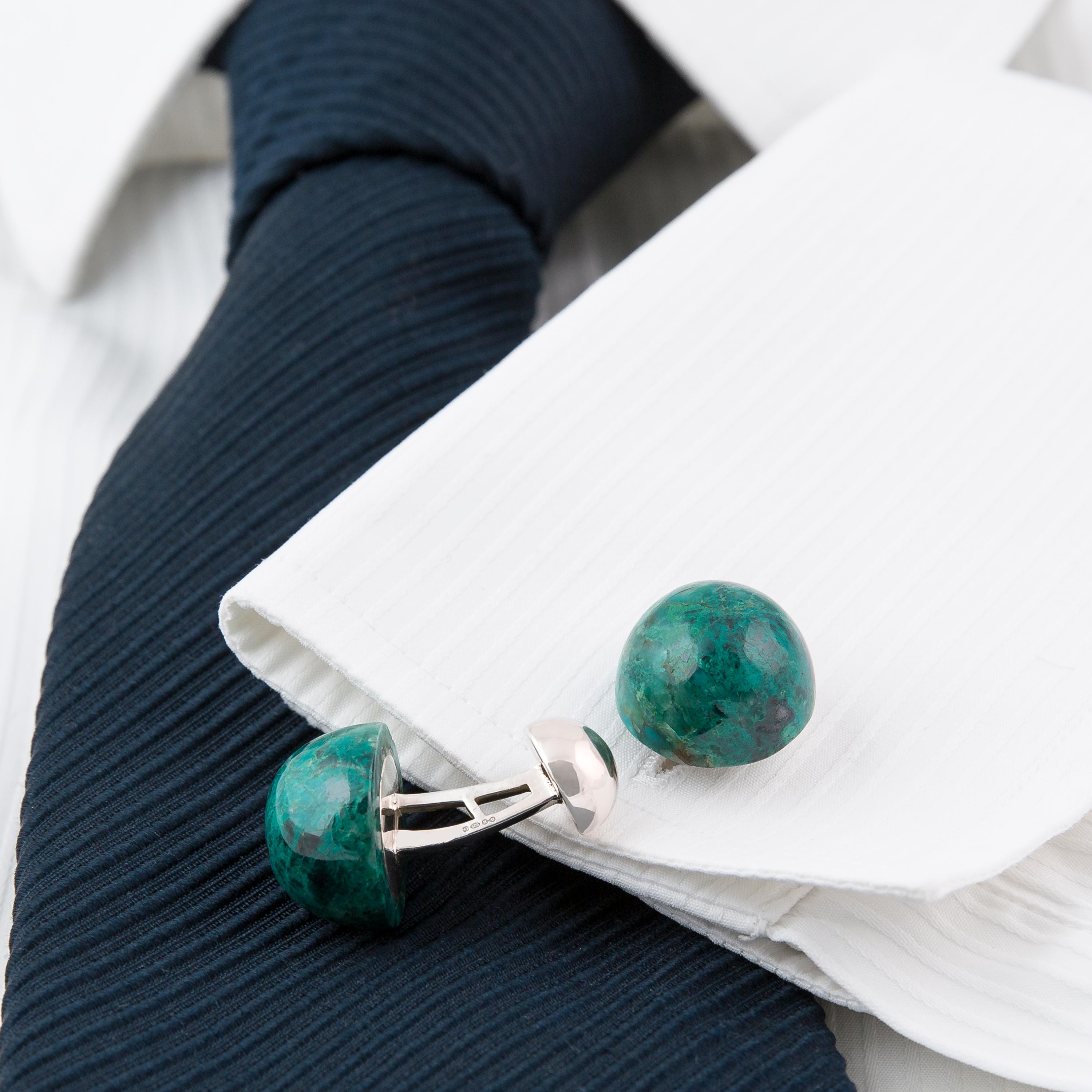 These statement cufflinks are designed and made in our Northern Irish workshop. These large one-of-a-kind blue-green Chrysocolla stones have been made into dome-shaped cabochon cufflinks - each stone having a weight of 24 carats and measuring 18 mm