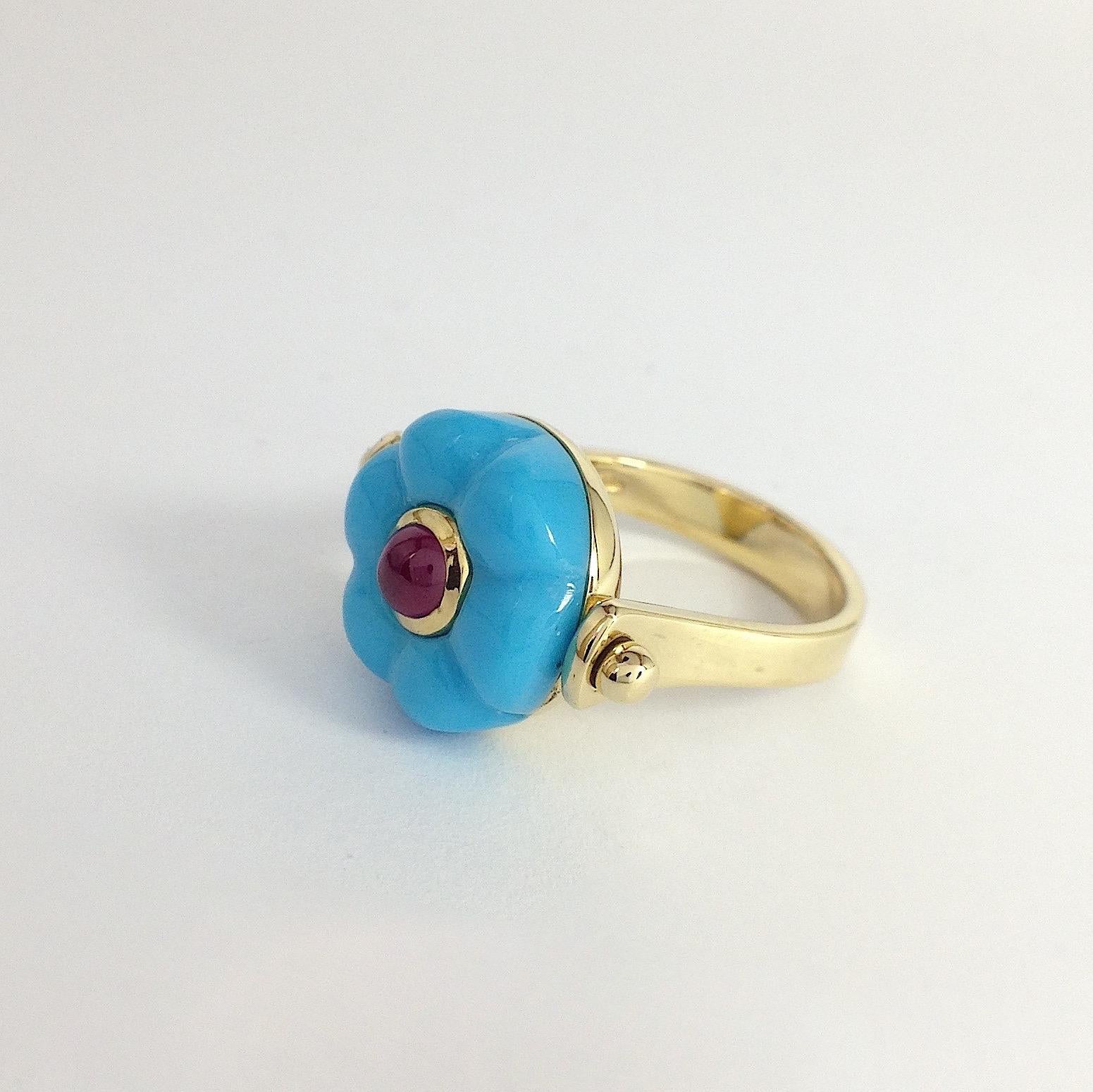 Made in Italy Gemstone Ruby Turquoise 18 Karat Gold Roman Style Turnable Ring
This ring is inspired by ancient Roman jewelry. They used to wear a ring where its head would be round. There's a light blue round natural turquoise as a button above and