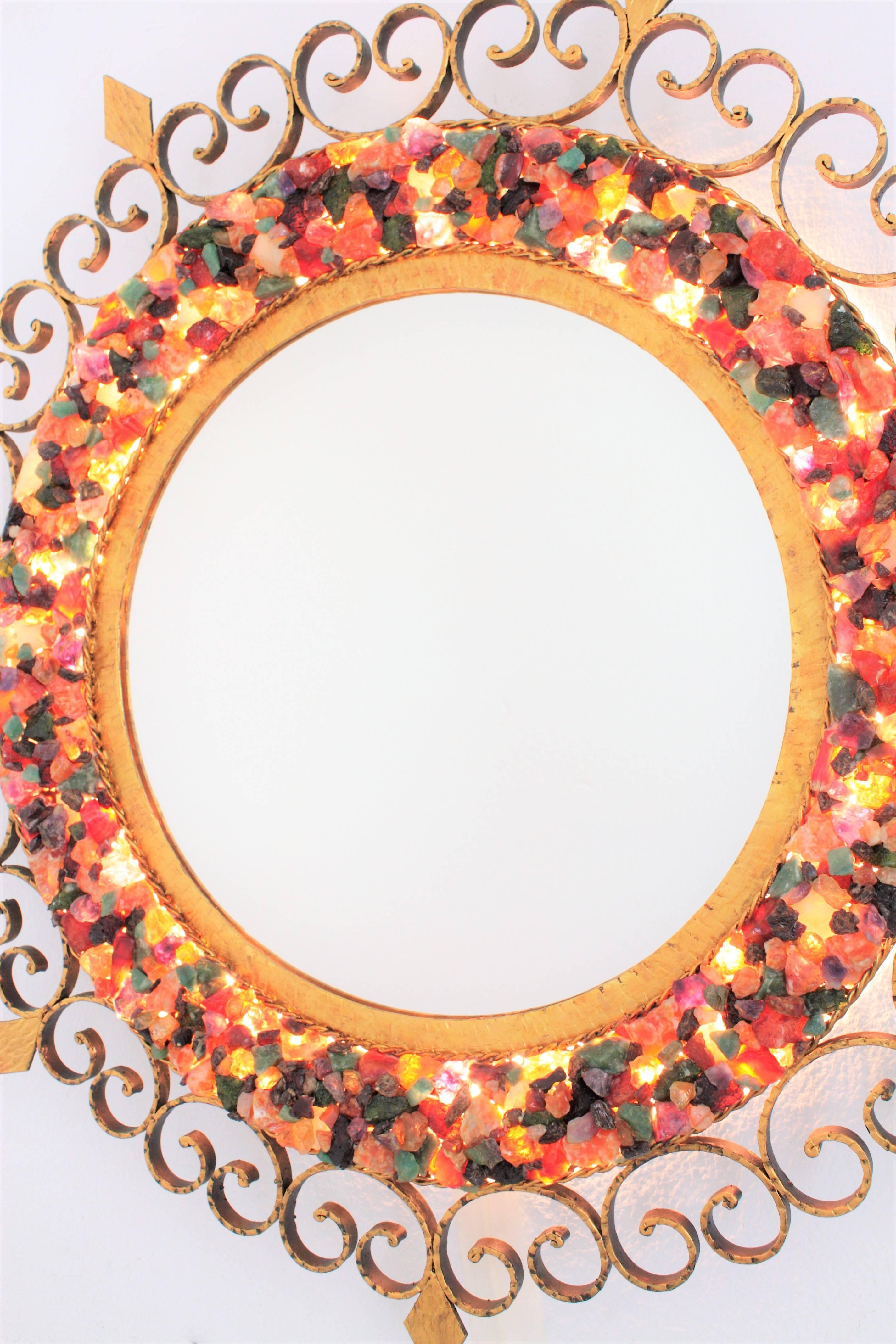 Hammered Sunburst Backlit Wall Mirror with Gemstone Gilt Iron Scrollwork Frame For Sale