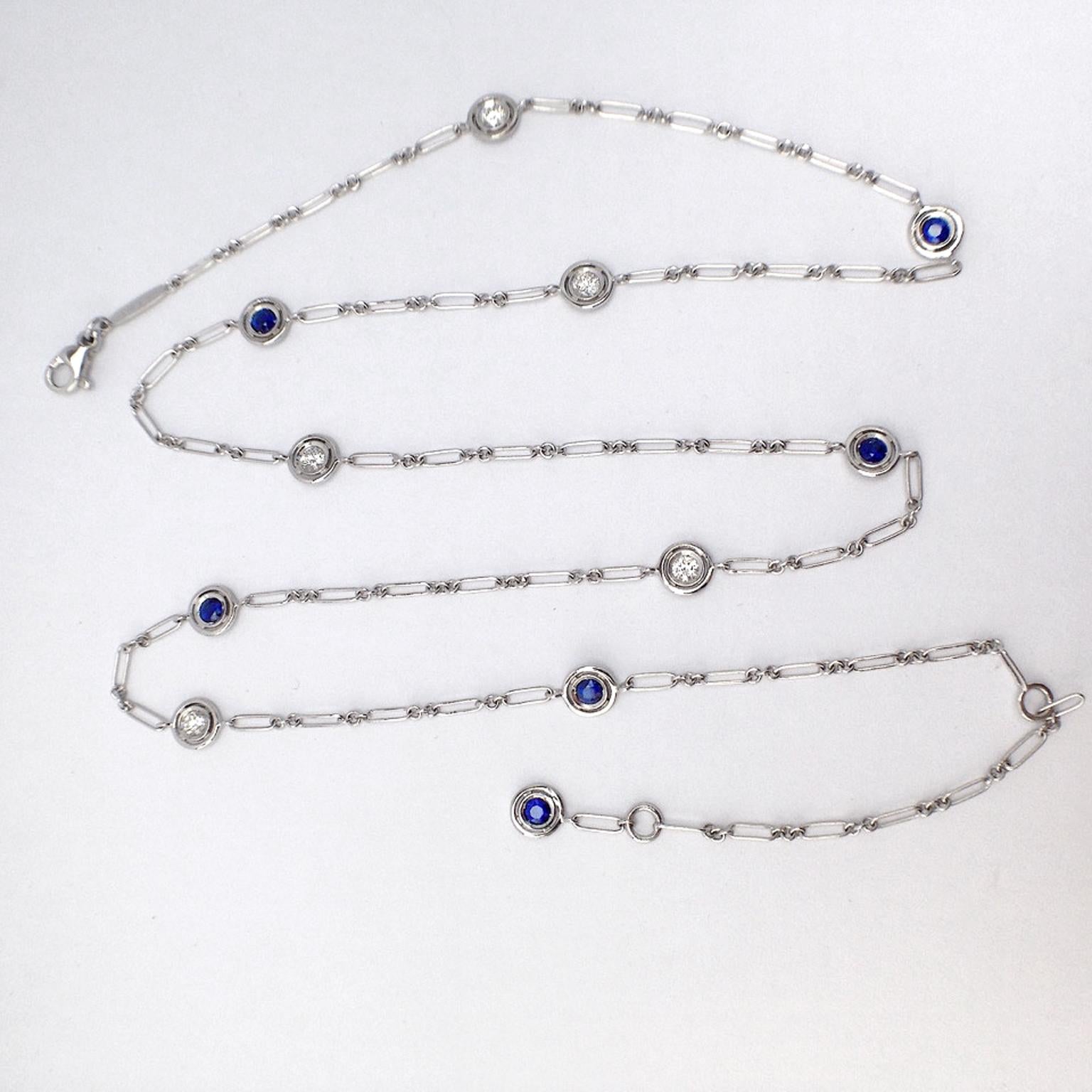 This chain is completely handmade. It's style is inspired by the 1920s and is interspersed with 10 rings with a stone in each of them, and another one at he end of the chain.
They are five white diamonds for a total of ct 0.45 and six blue sapphires