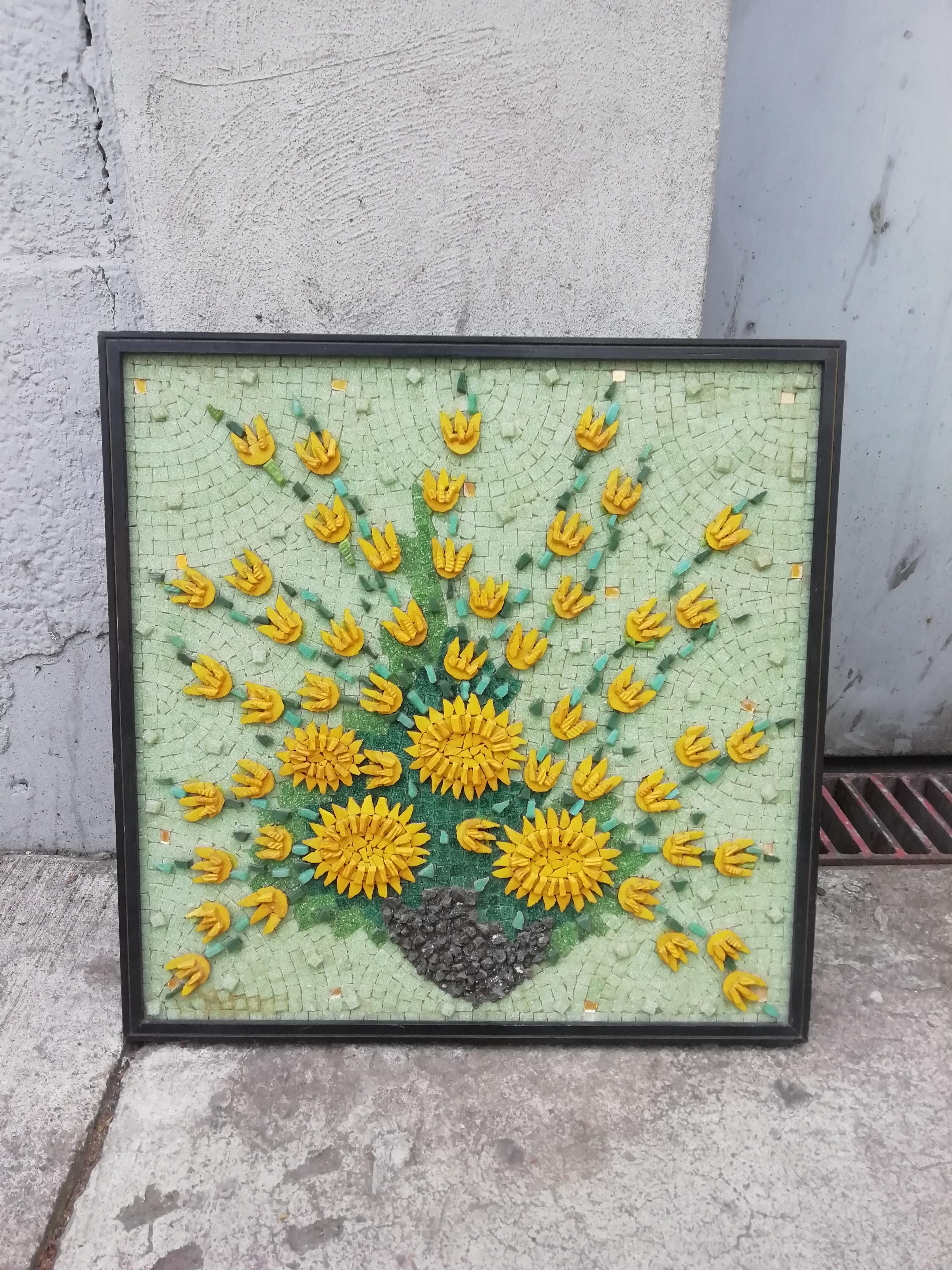 Rare and beautiful Mexican Mid-Century Modern mosaic by Genaro Alvarez depicting a yellow chrysanthemum still life over a pale green background. The mosaic is mounted over a wood board that carries the artist's signature and seal.