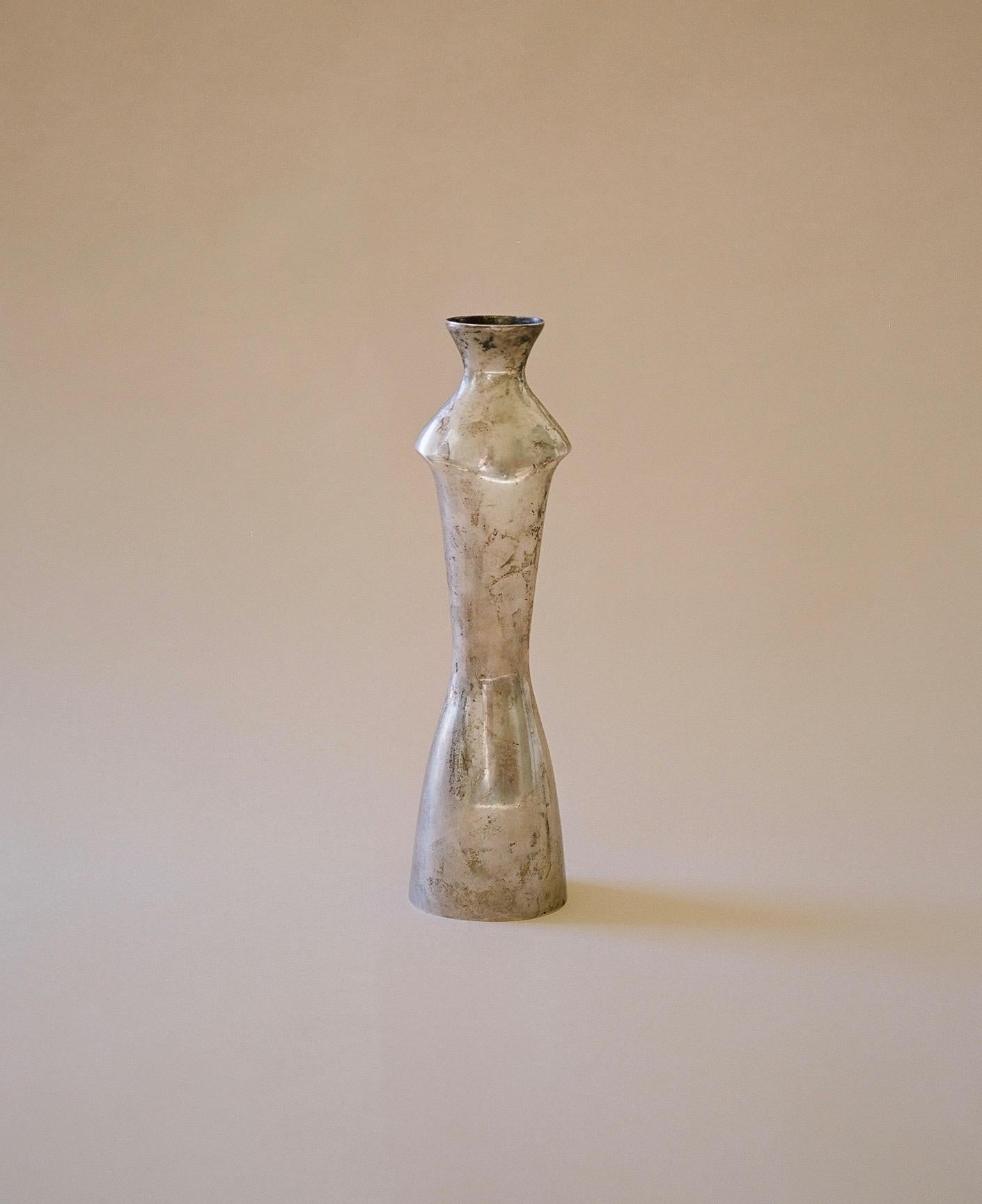 An Italian sterling silver vase in the form of a modernist torso. Marked Fabbrica Genazzi. Luigi Genazzi (1876-1946) began work as a silversmith in the 1920s gaining enough success to eventually open his own factory in Milan. There, Genazzi designed