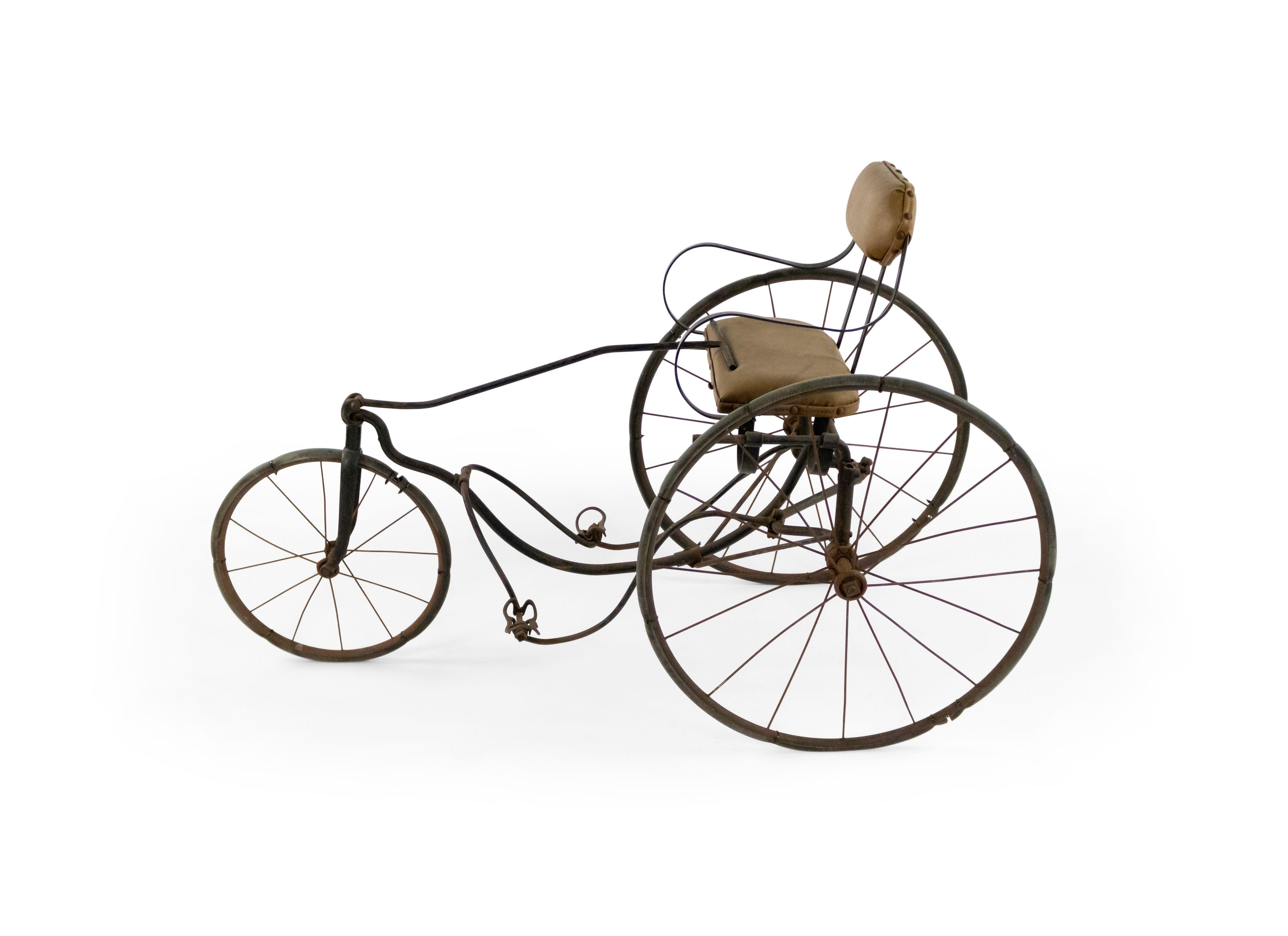 American Victorian iron tricycle with a carriage seat (tag: GENDRON WHEEL CO., TOLEDO, OH)
