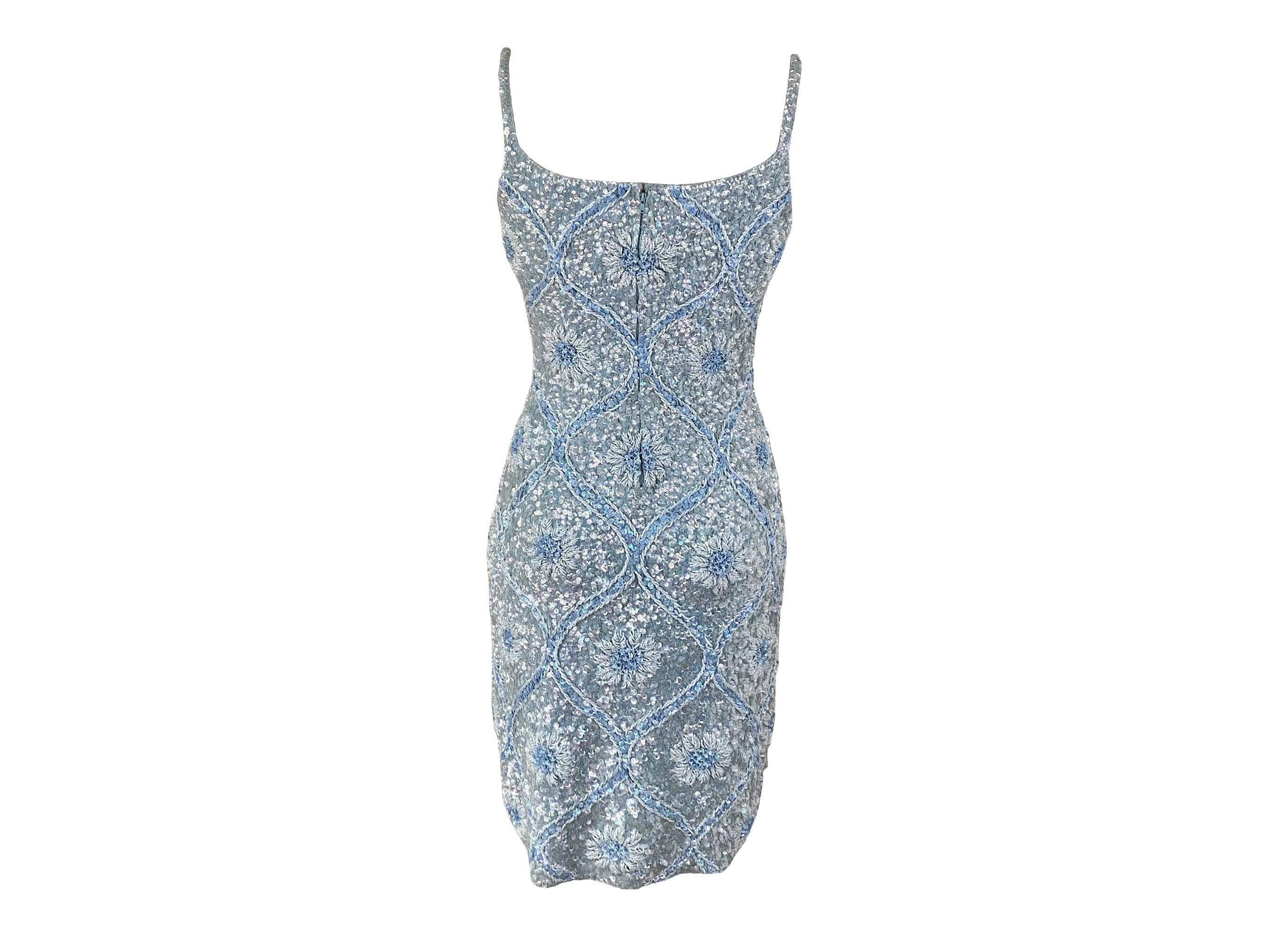 Gene Shelly's formal and cocktail beaded garments are much sought after and are absolutely extraordinary. This Gene Shelly dress is no exception. Completely covered in hand-sewn pastel blue and aurora borealis iridescent sequins... the time it must