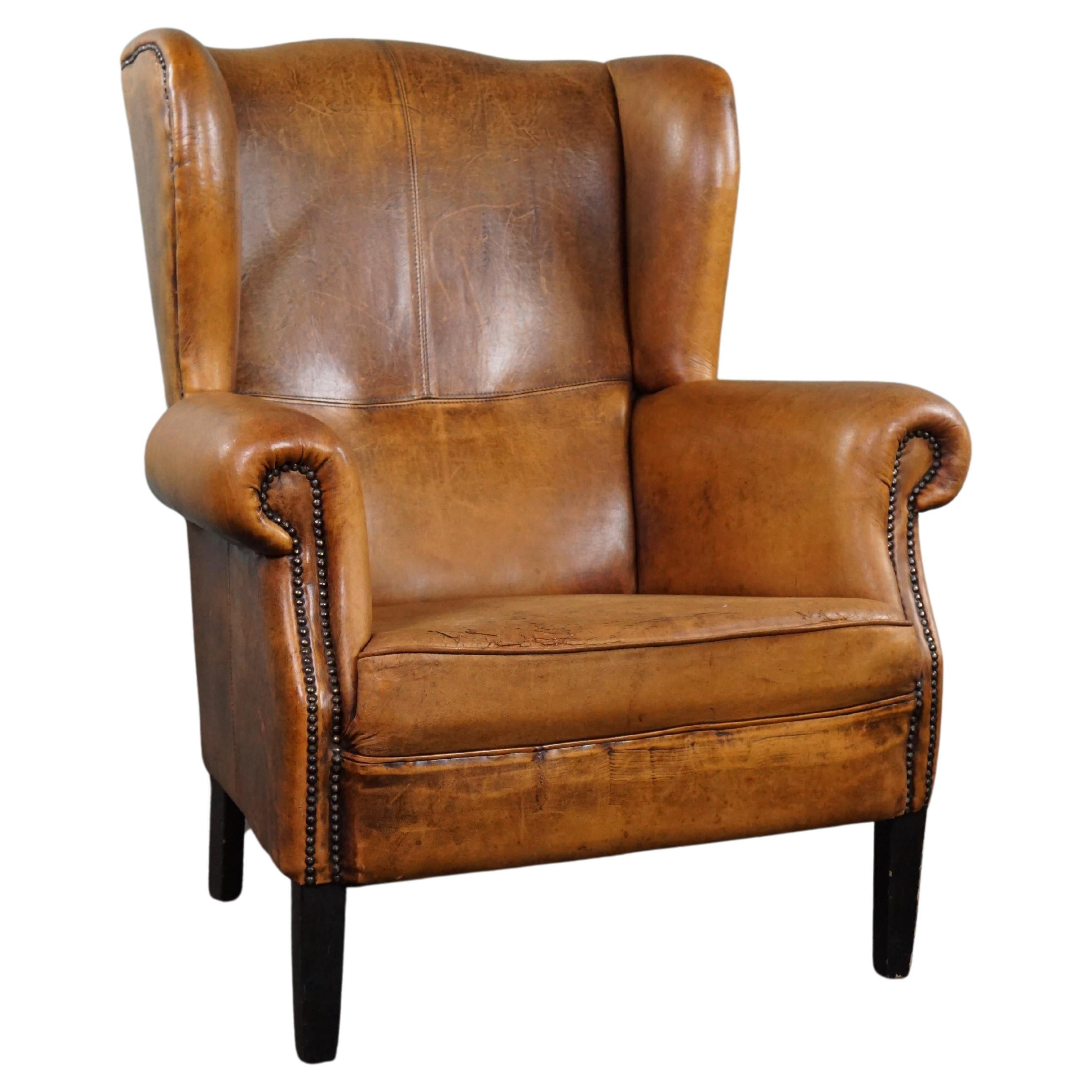 Generous and characterful sheep leather wingback chair