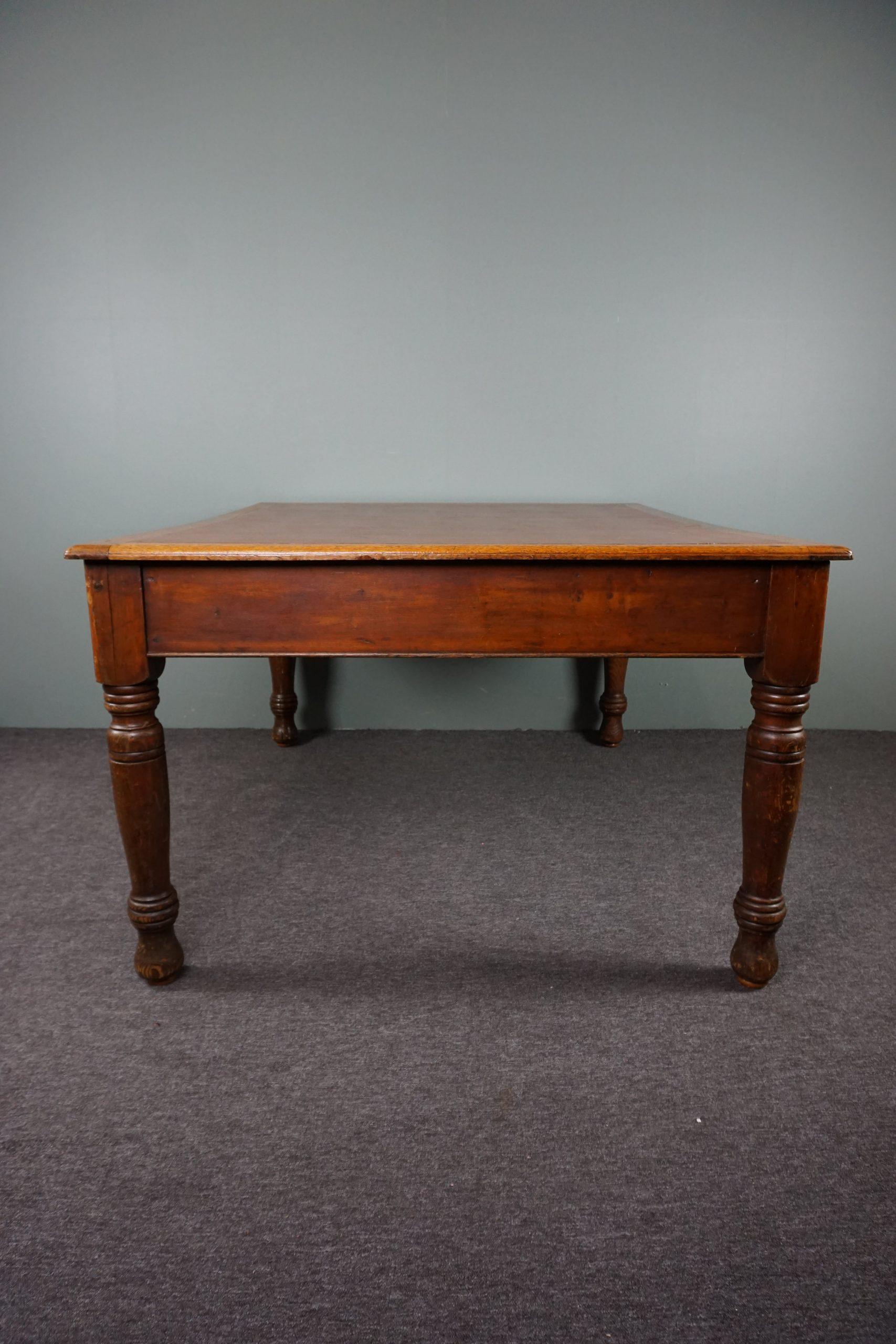 Offered is this sturdy antique writing table with a beautiful lived-in appearance.

This is a fantastic and completely original early 20th century writing desk supplied by Withy Grove Stores in Manchester. Withy Grove Stores originally supplied